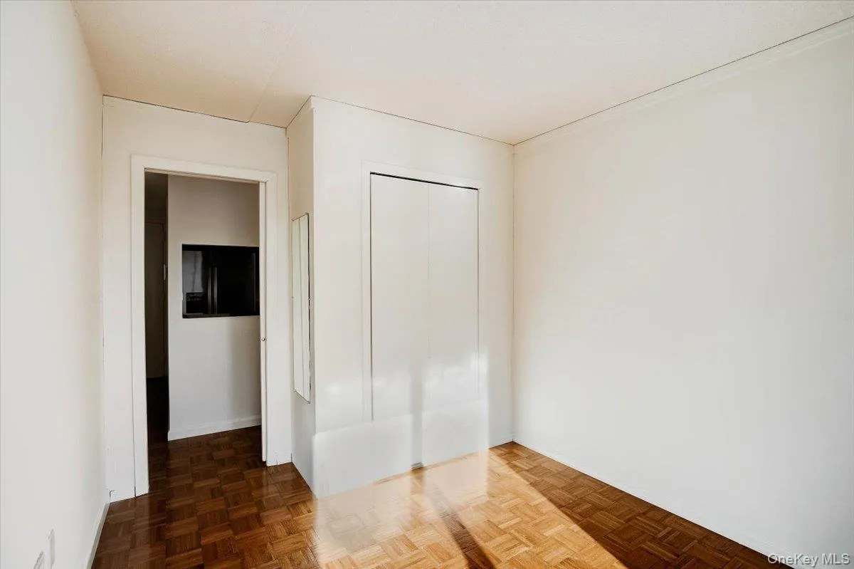 Unfurnished bedroom with a closet Unfurnished bedroom with a closet