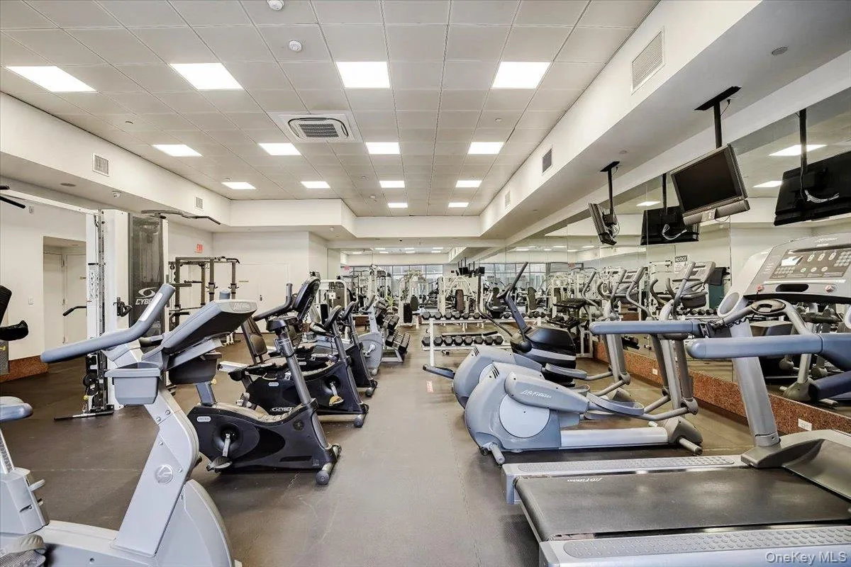 Exercise room featuring a paneled ceiling Exercise room featuring a paneled ceiling