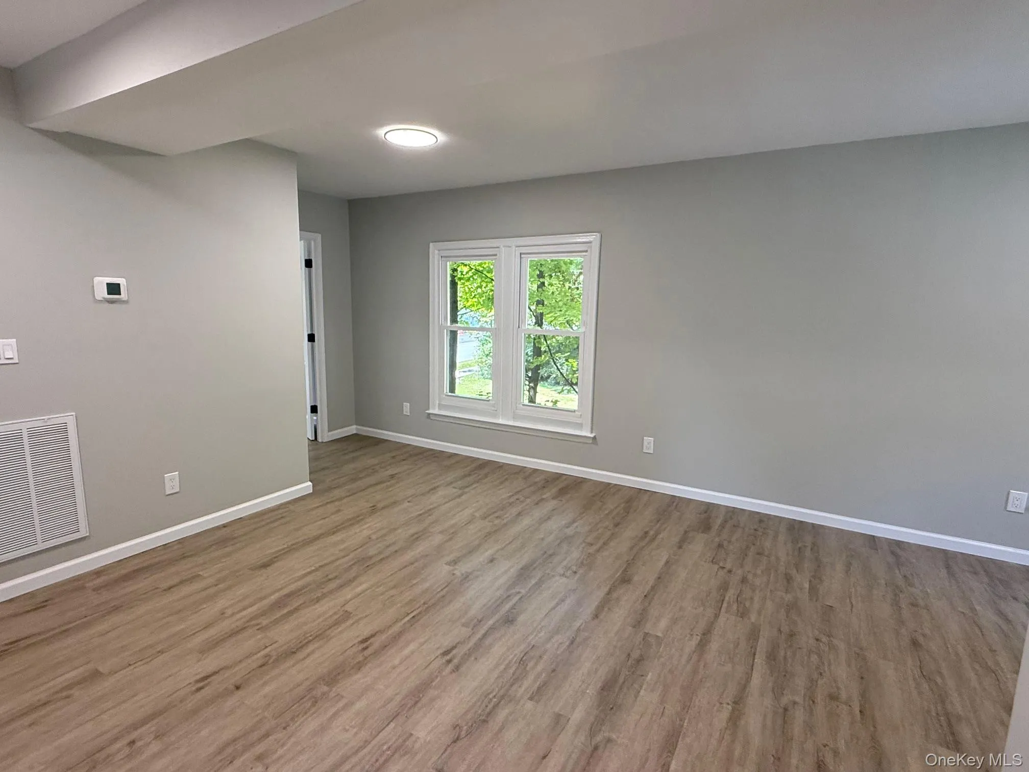 Empty room featuring wood finished floors Empty room featuring wood finished floors