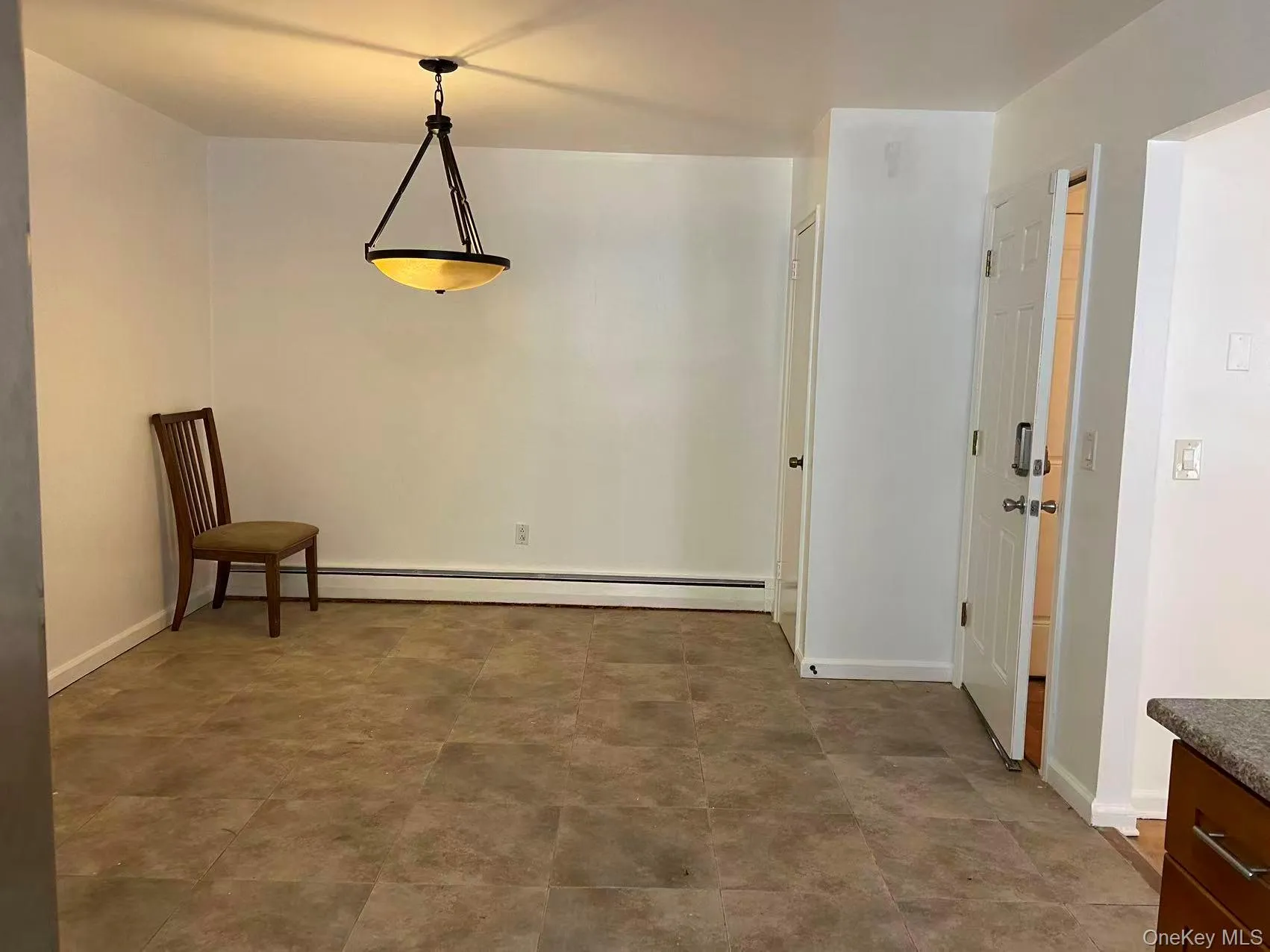 Unfurnished dining area featuring baseboards and baseboard heating Unfurnished dining area featuring baseboards and baseboard heating