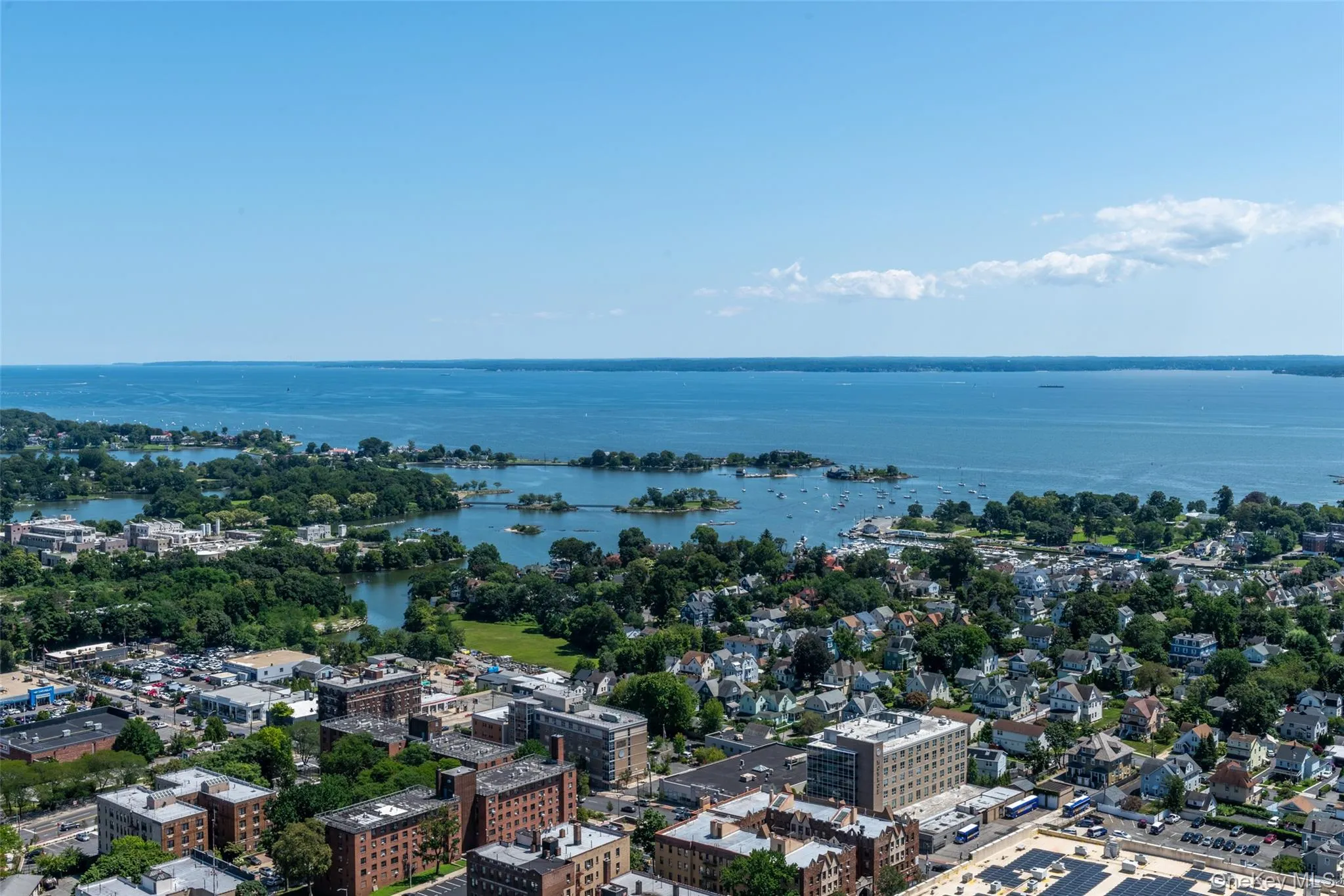 View of urban area with a large body of water View of urban area with a large body of water