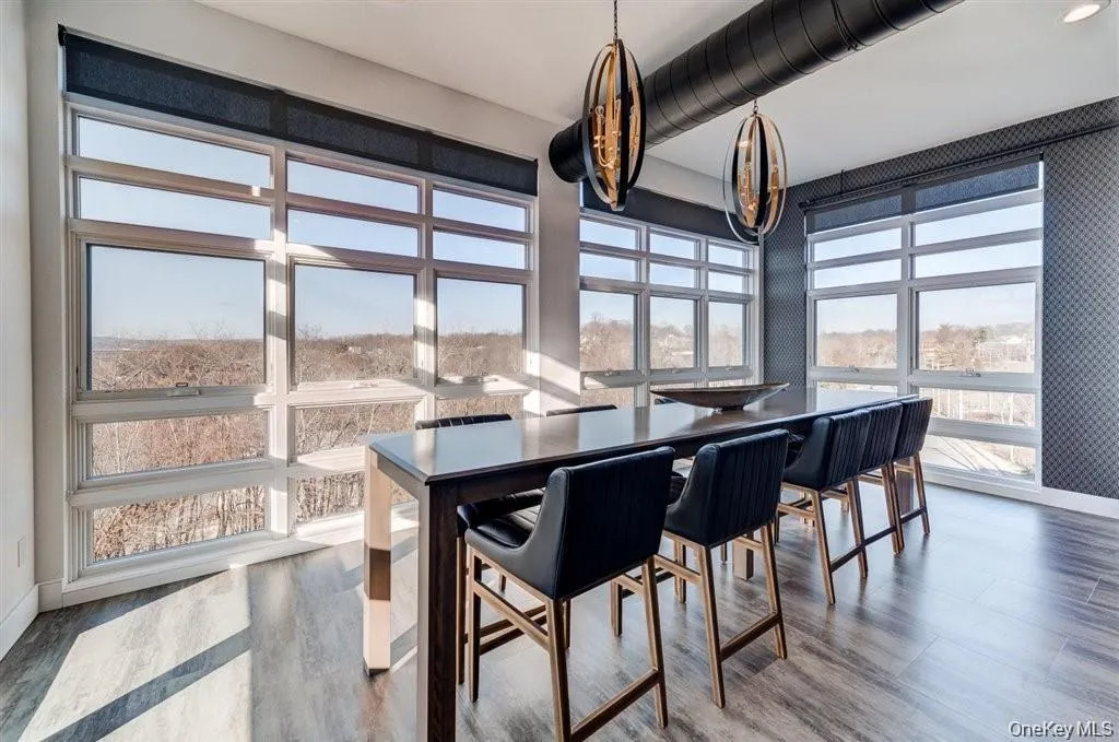 Dining room featuring wood finished floors and baseboards Dining room featuring wood finished floors and baseboards