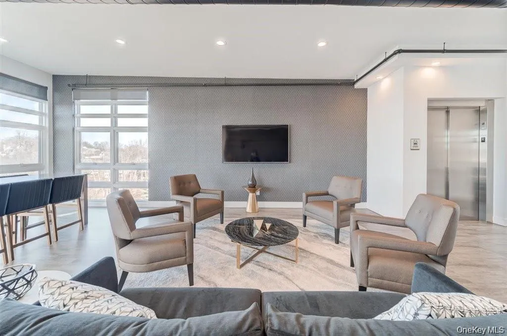Living area featuring recessed lighting and elevator Living area featuring recessed lighting and elevator