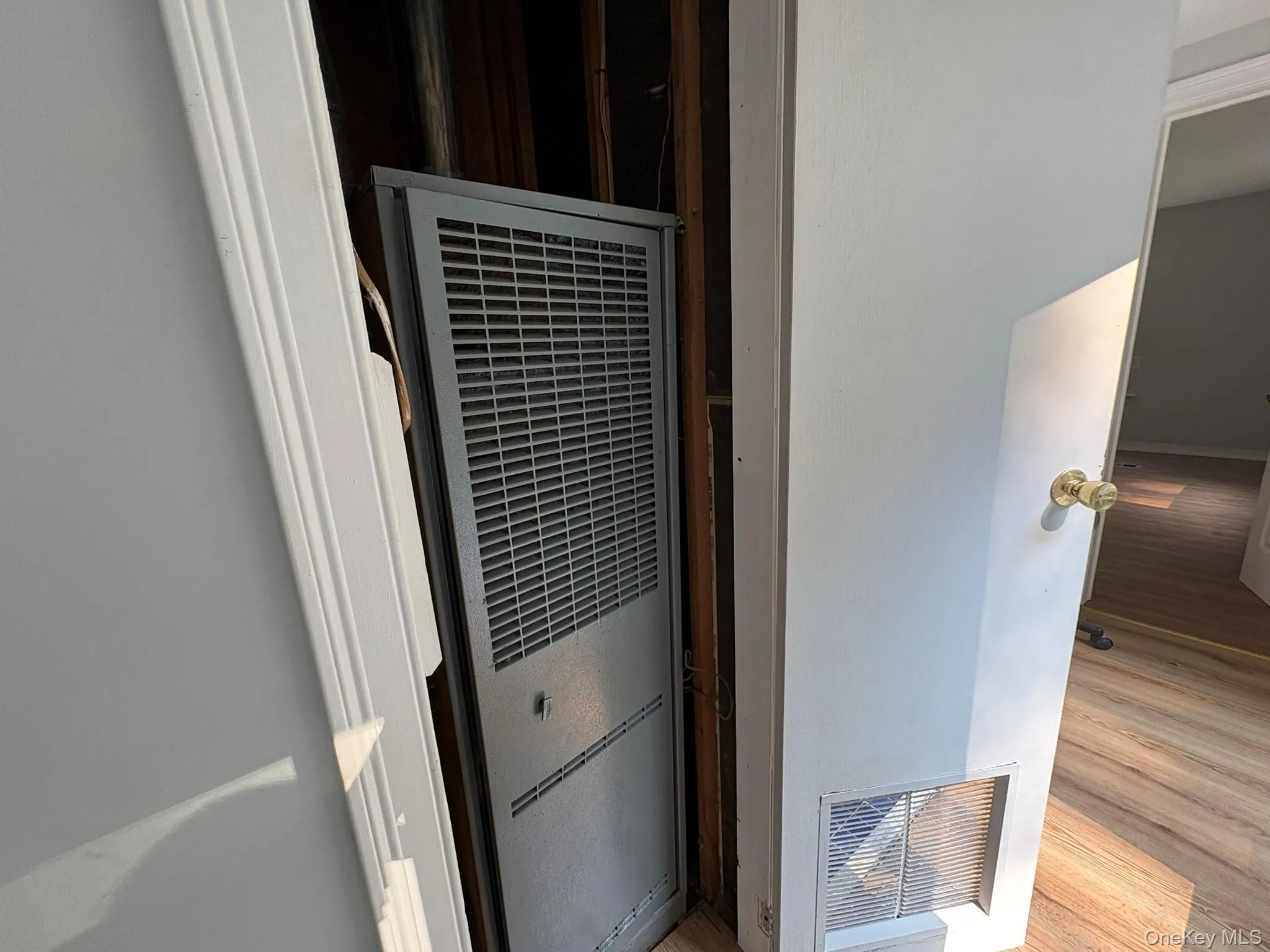 Detailed view of a heating unit and wood finished floors Detailed view of a heating unit and wood finished floors