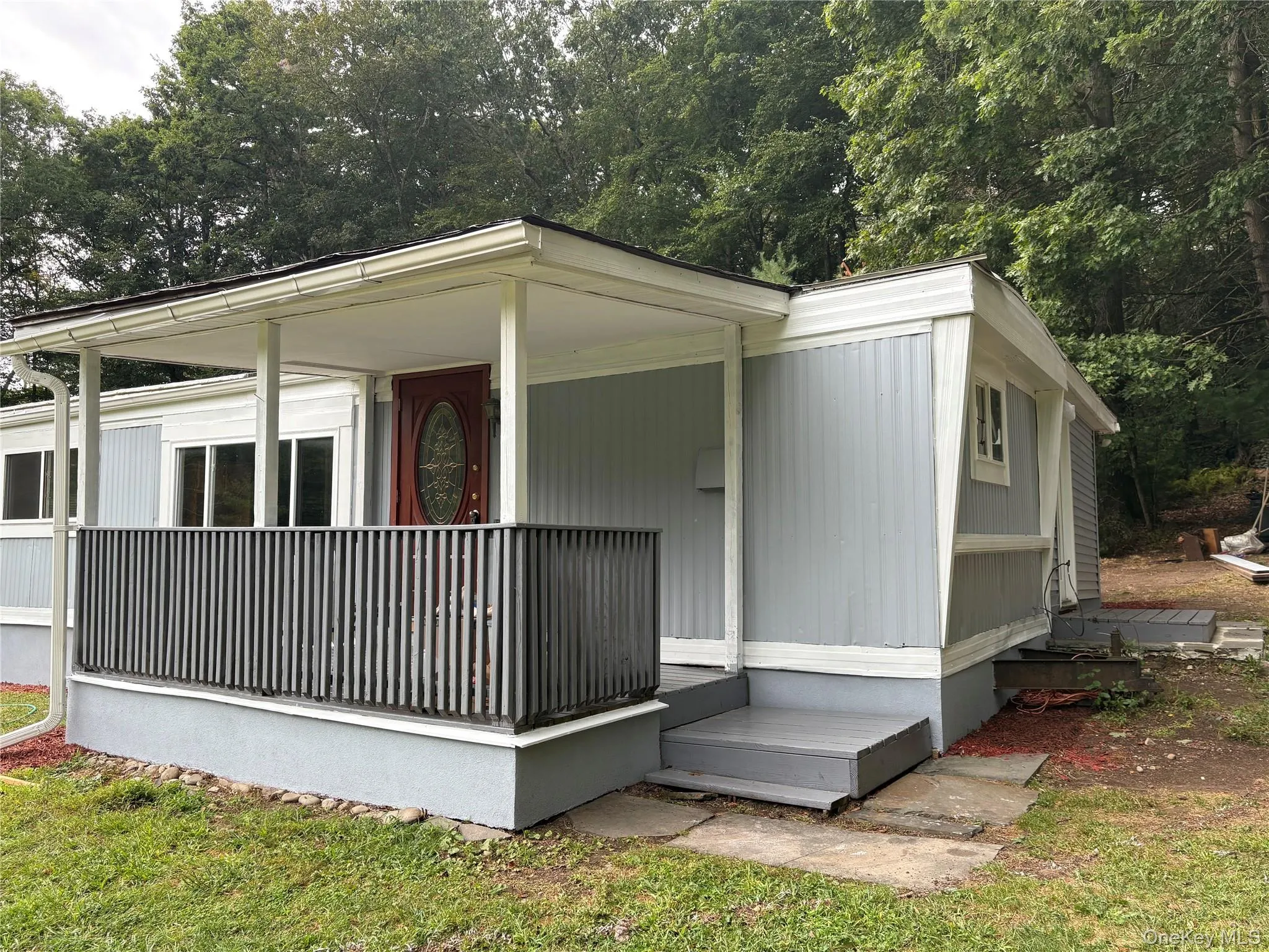 View of front and side of home with a porch View of front and side of home with a porch