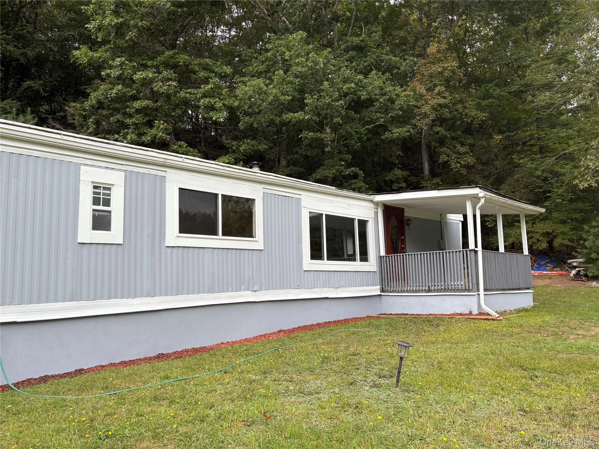 View of property exterior with a yard View of property exterior with a yard
