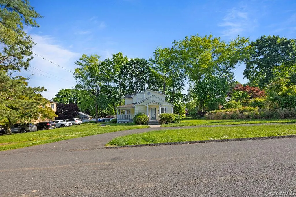 Bungalow-style house featuring a front yard Bungalow-style house featuring a front yard