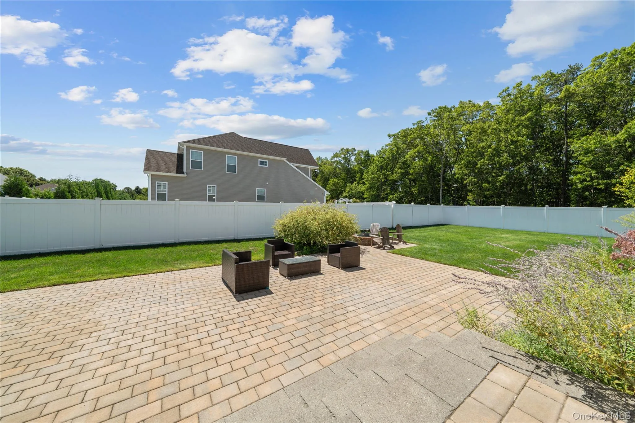 Fenced backyard with a patio Fenced backyard with a patio