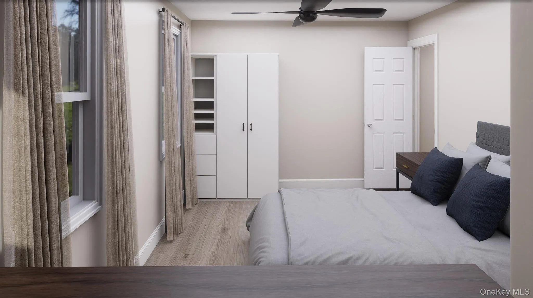 Bedroom featuring light wood-style flooring and a ceiling fan Bedroom featuring light wood-style flooring and a ceiling fan