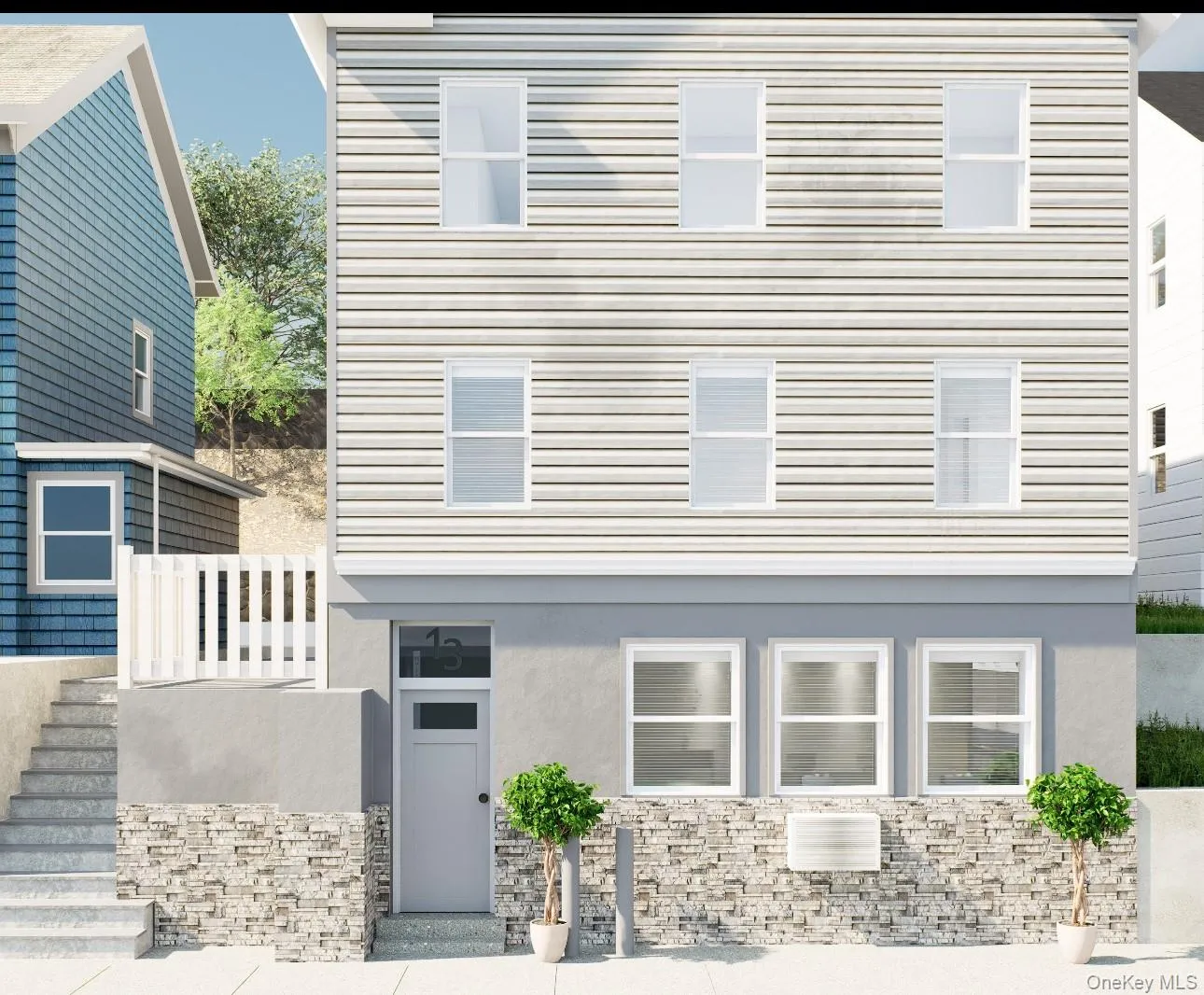 View of front of house featuring stucco siding, stairway, and stone siding View of front of house featuring stucco siding, stairway, and stone siding