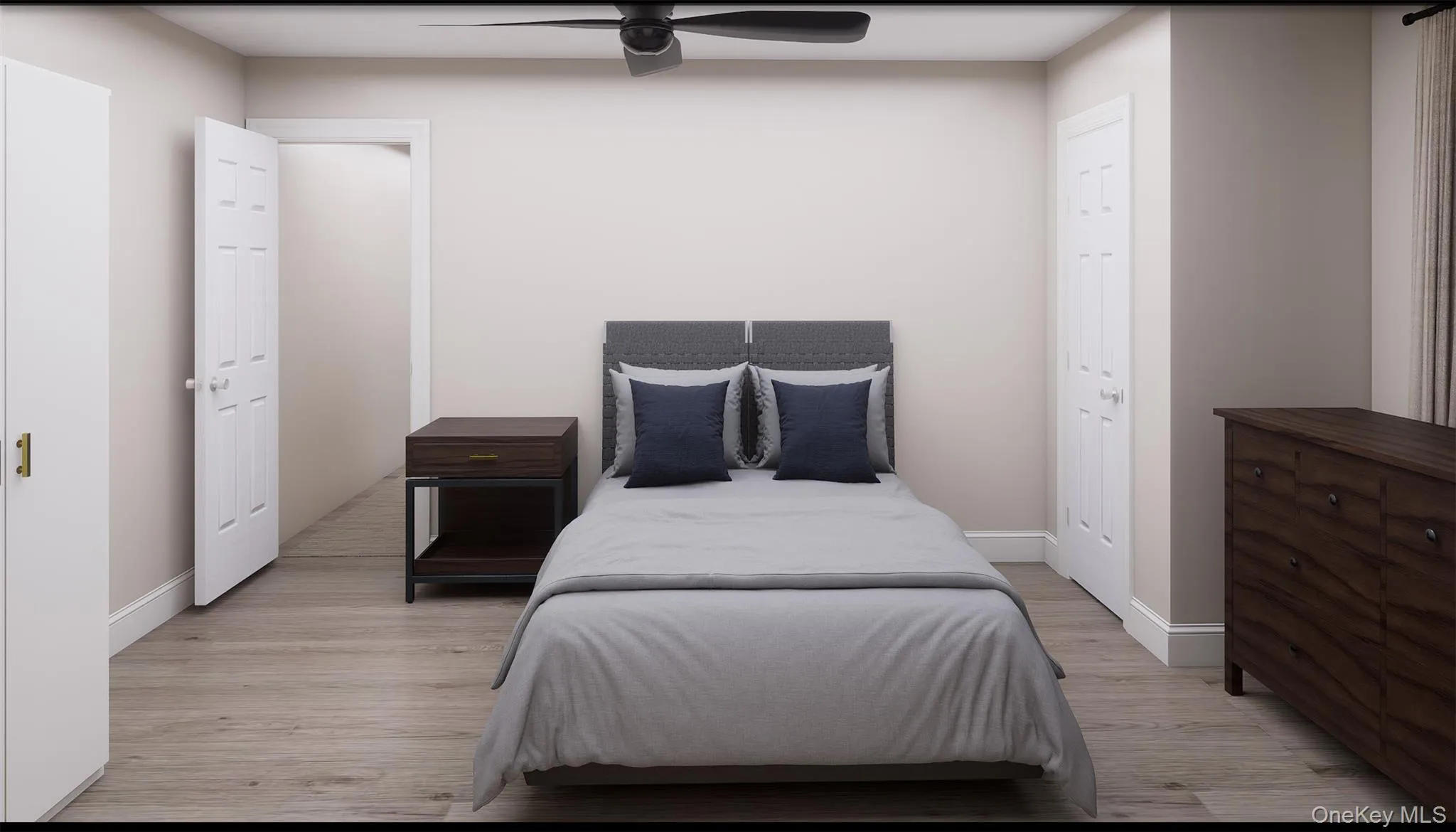 Bedroom featuring light wood-type flooring and a ceiling fan Bedroom featuring light wood-type flooring and a ceiling fan