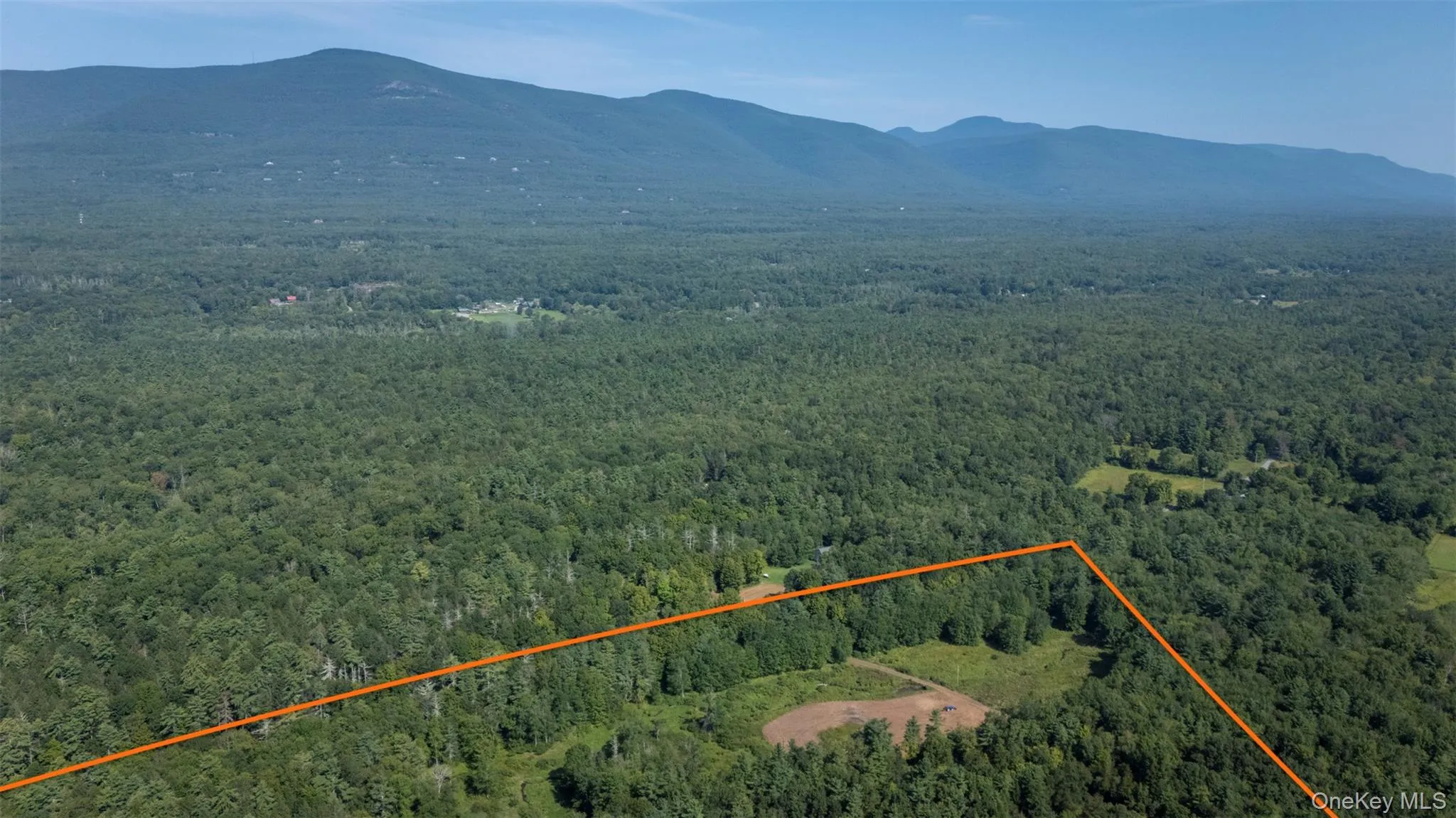 View of property location featuring property parcel outlined and mountains View of property location featuring property parcel outlined and mountains