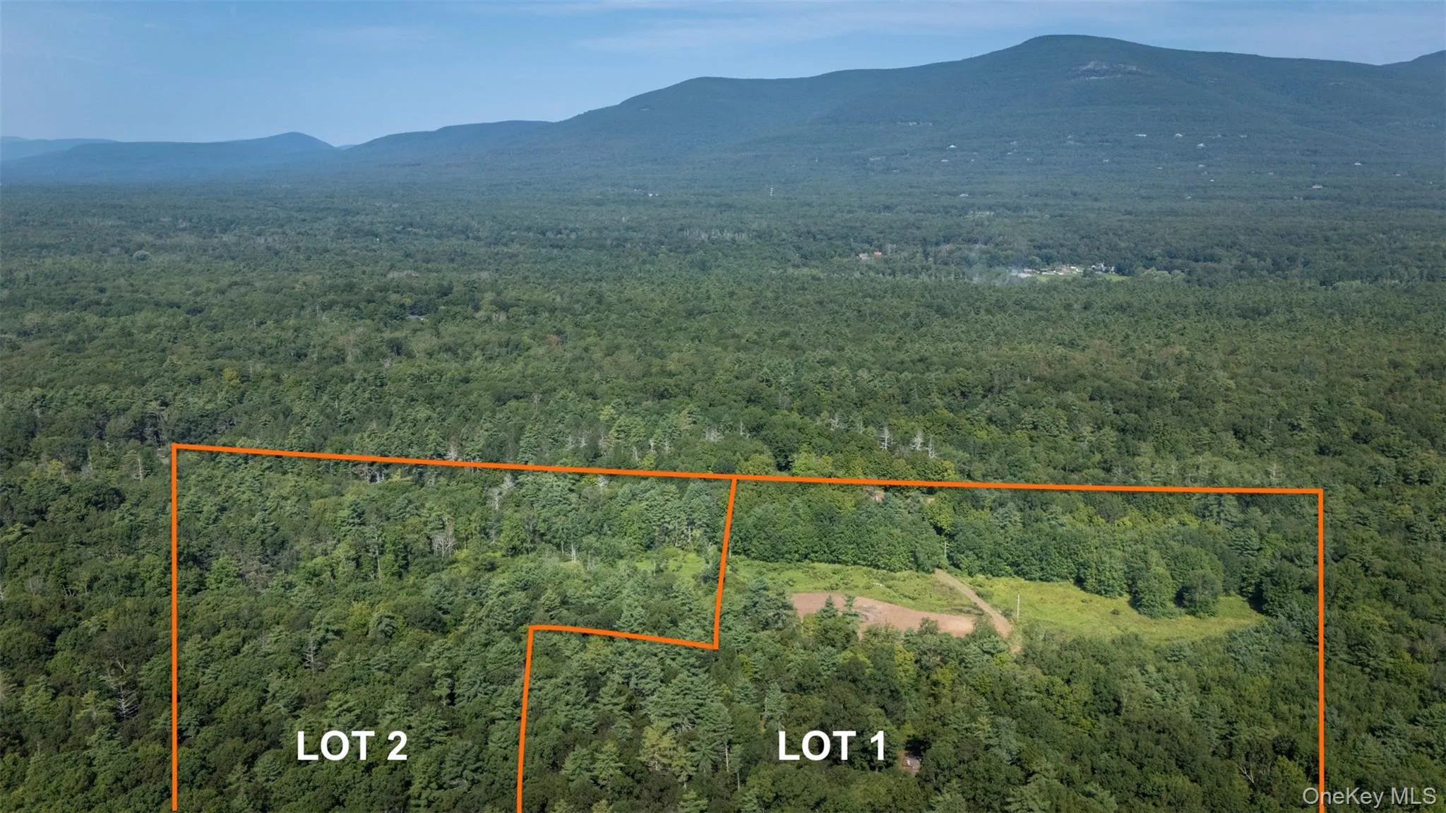 Aerial overview of property's location featuring mountains and property boundaries highlighted Aerial overview of property's location featuring mountains and property boundaries highlighted
