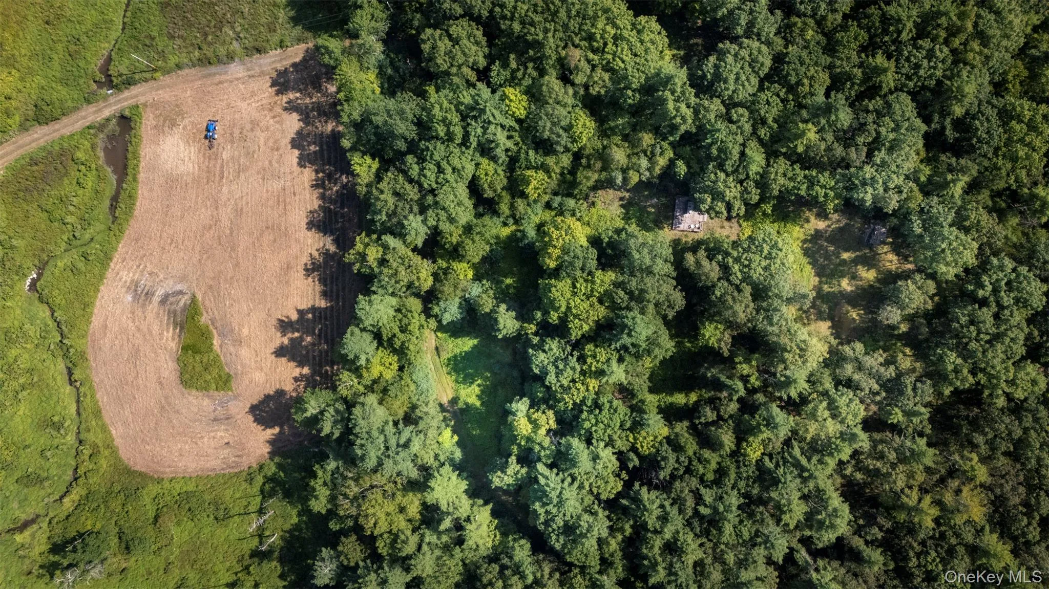 Aerial view of property's location featuring a heavily wooded area Aerial view of property's location featuring a heavily wooded area