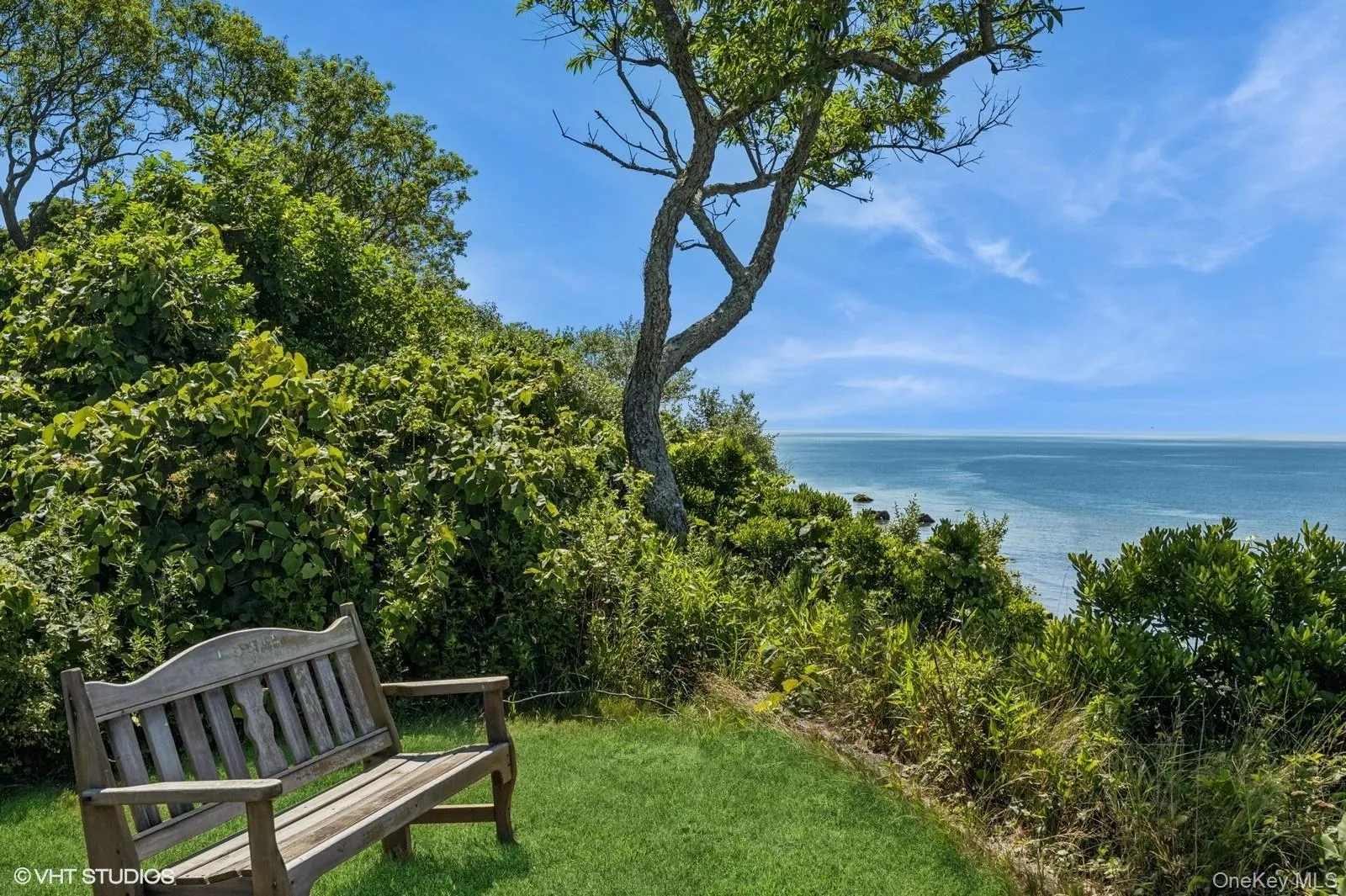 View of community with a water view and a lawn View of community with a water view and a lawn