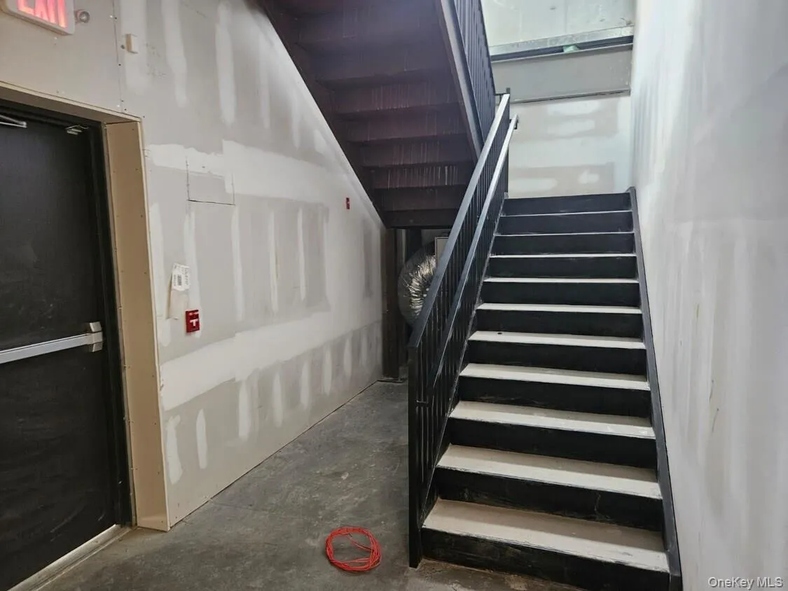 Stairs with unfinished concrete flooring Stairs with unfinished concrete flooring