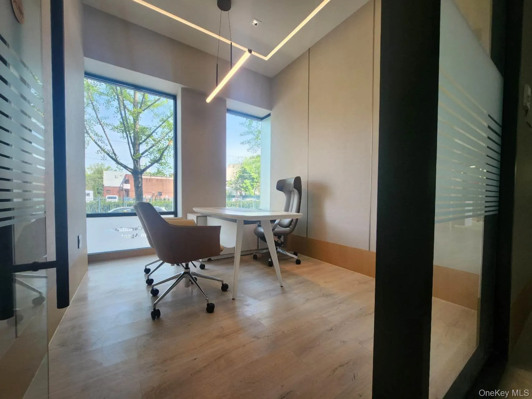 Office area with a healthy amount of sunlight, light wood-type flooring, and wooden walls Office area with a healthy amount of sunlight, light wood-type flooring, and wooden walls
