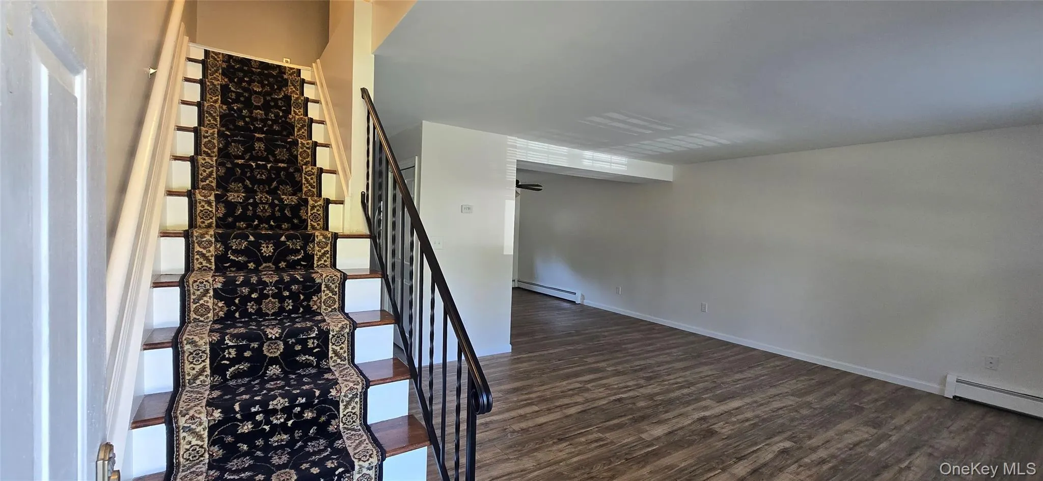 Living Room and stairs to 2nd floor Living Room and stairs to 2nd floor