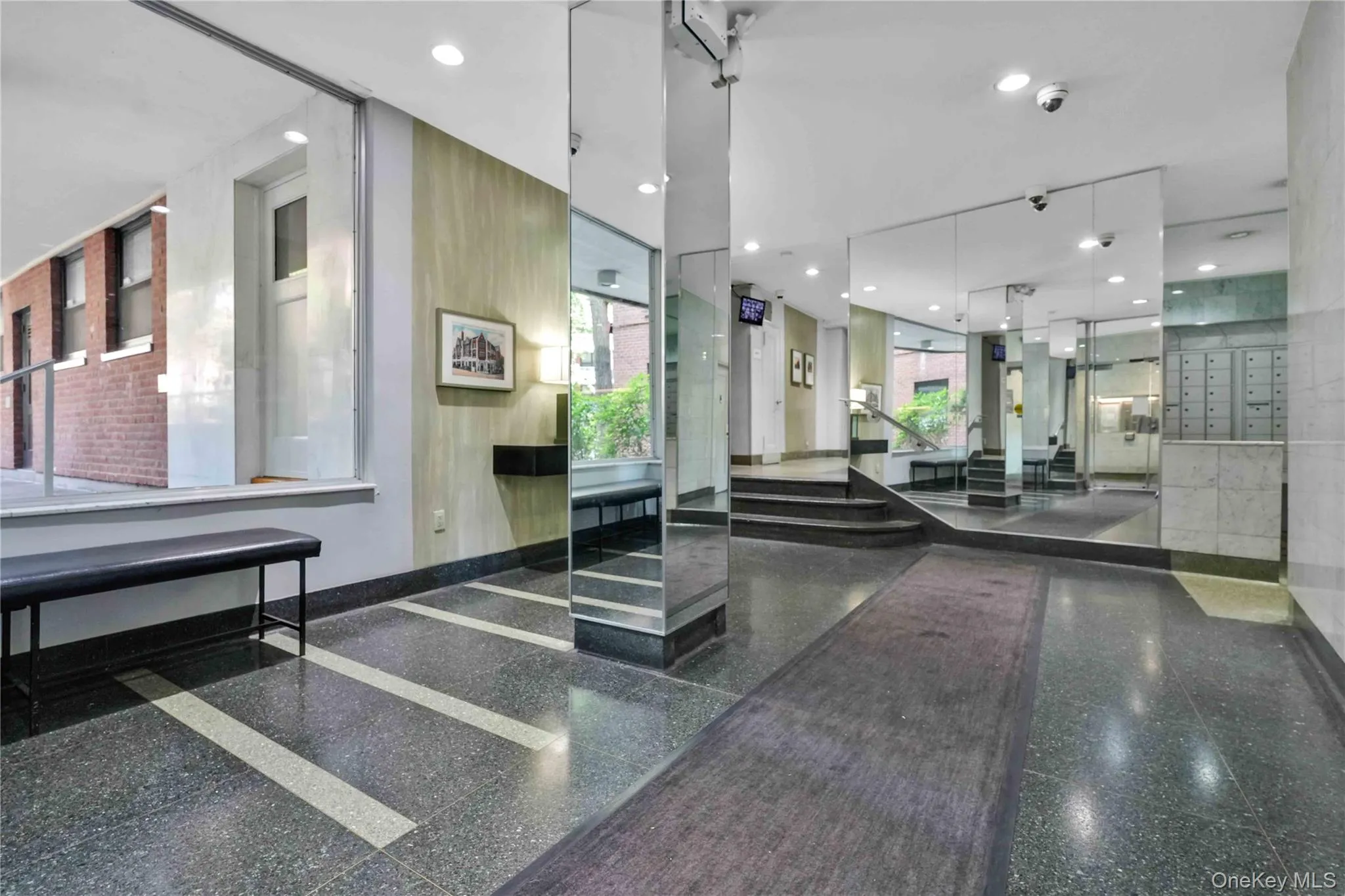 Building lobby featuring recessed lighting Building lobby featuring recessed lighting