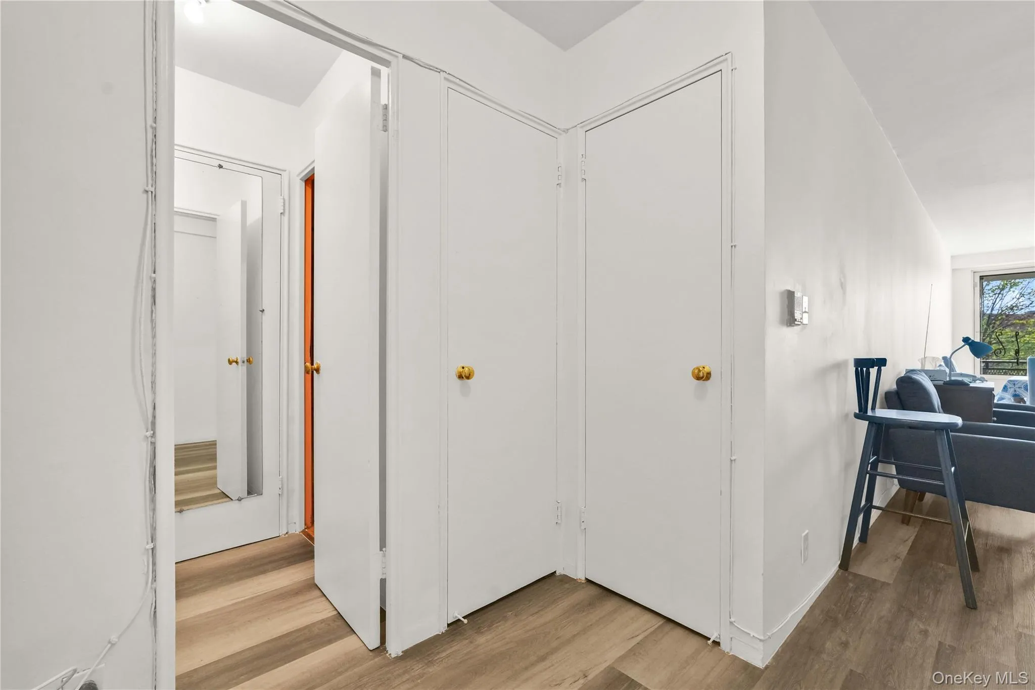 Hallway featuring light wood-style flooring Hallway featuring light wood-style flooring