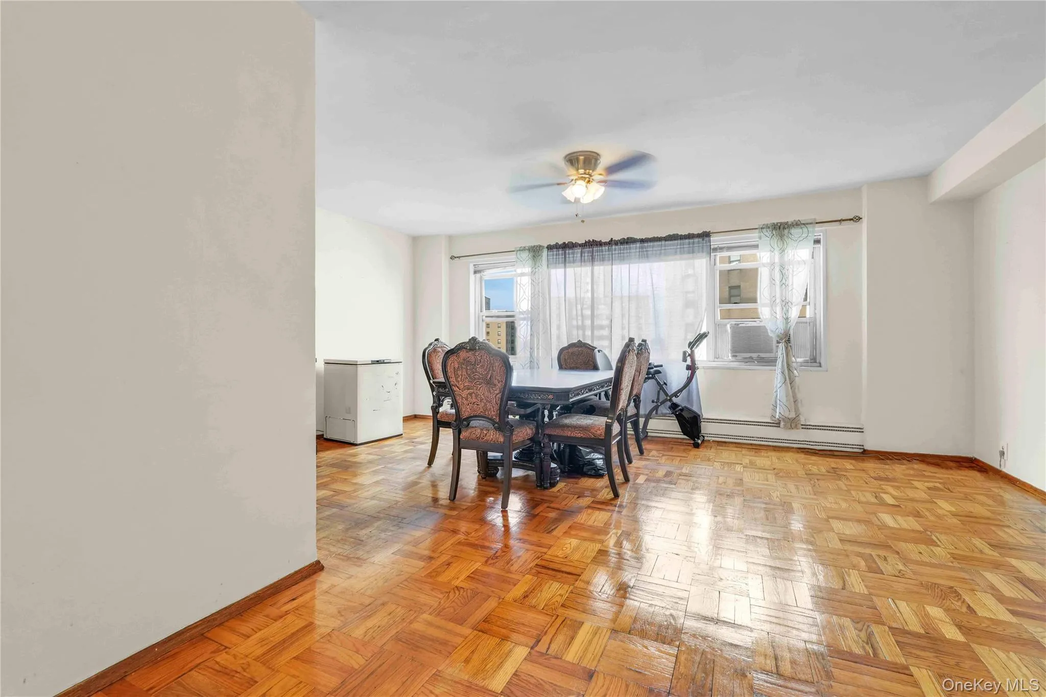 Dining room featuring ceiling fan and baseboard heating Dining room featuring ceiling fan and baseboard heating