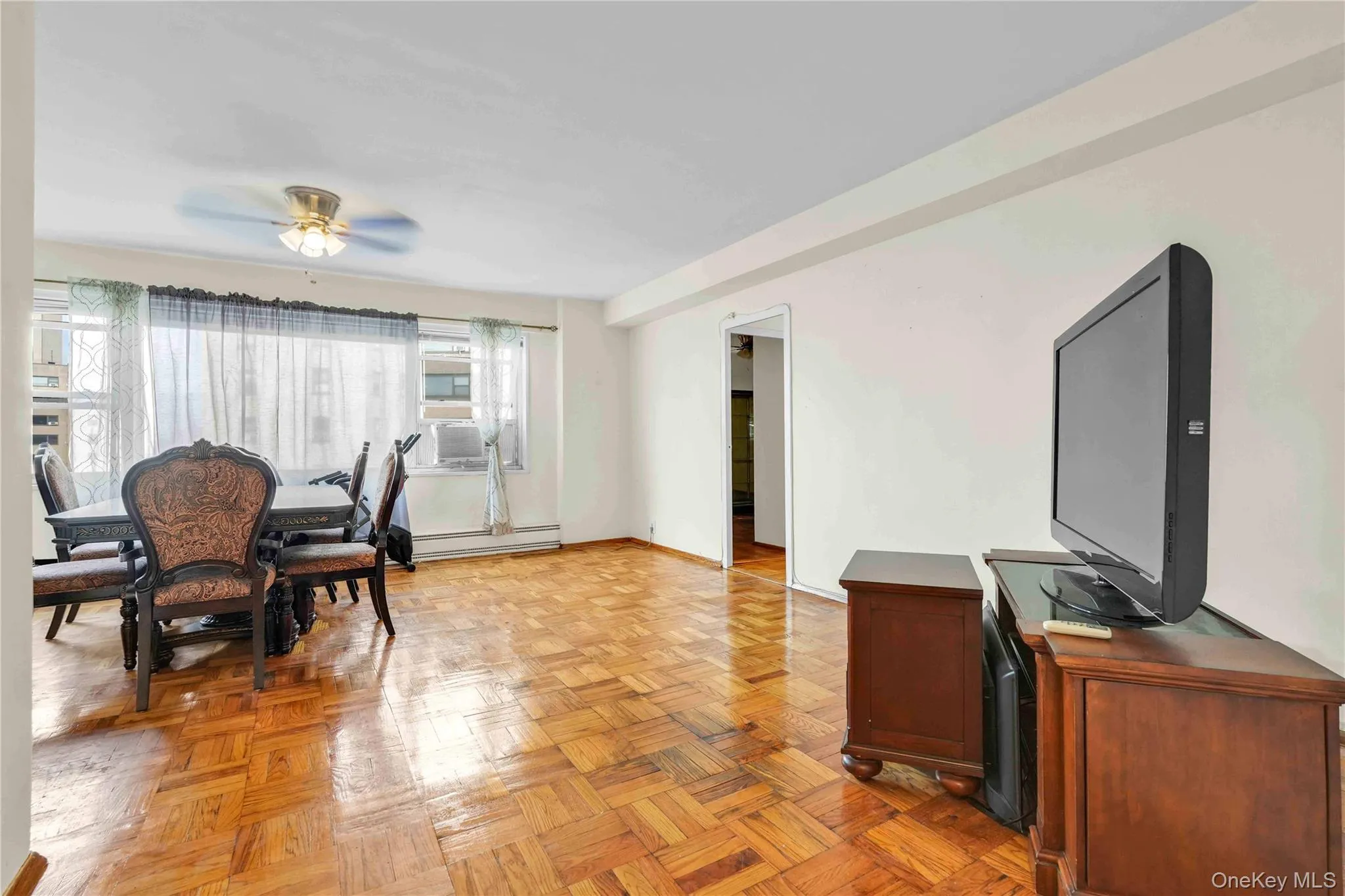Dining room with ceiling fan and baseboard heating Dining room with ceiling fan and baseboard heating