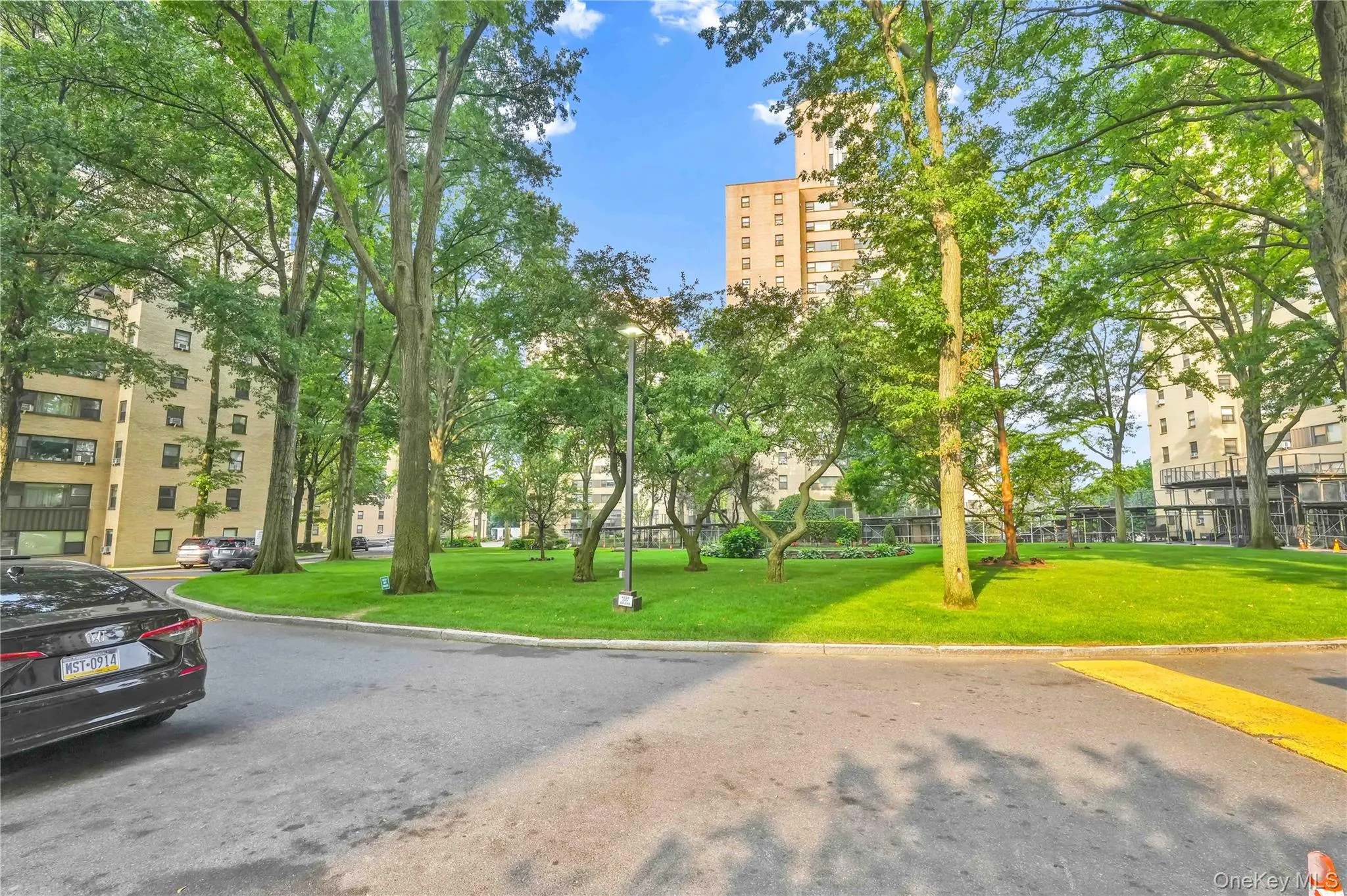 View of property's community featuring a lawn View of property's community featuring a lawn