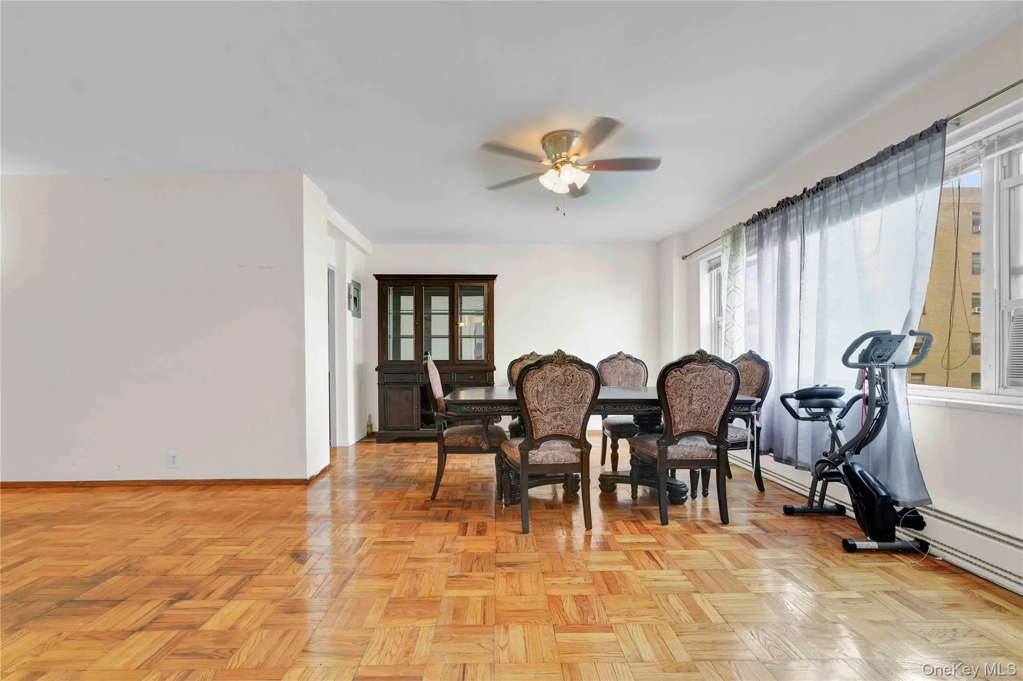 Dining space featuring ceiling fan and a baseboard heating unit Dining space featuring ceiling fan and a baseboard heating unit