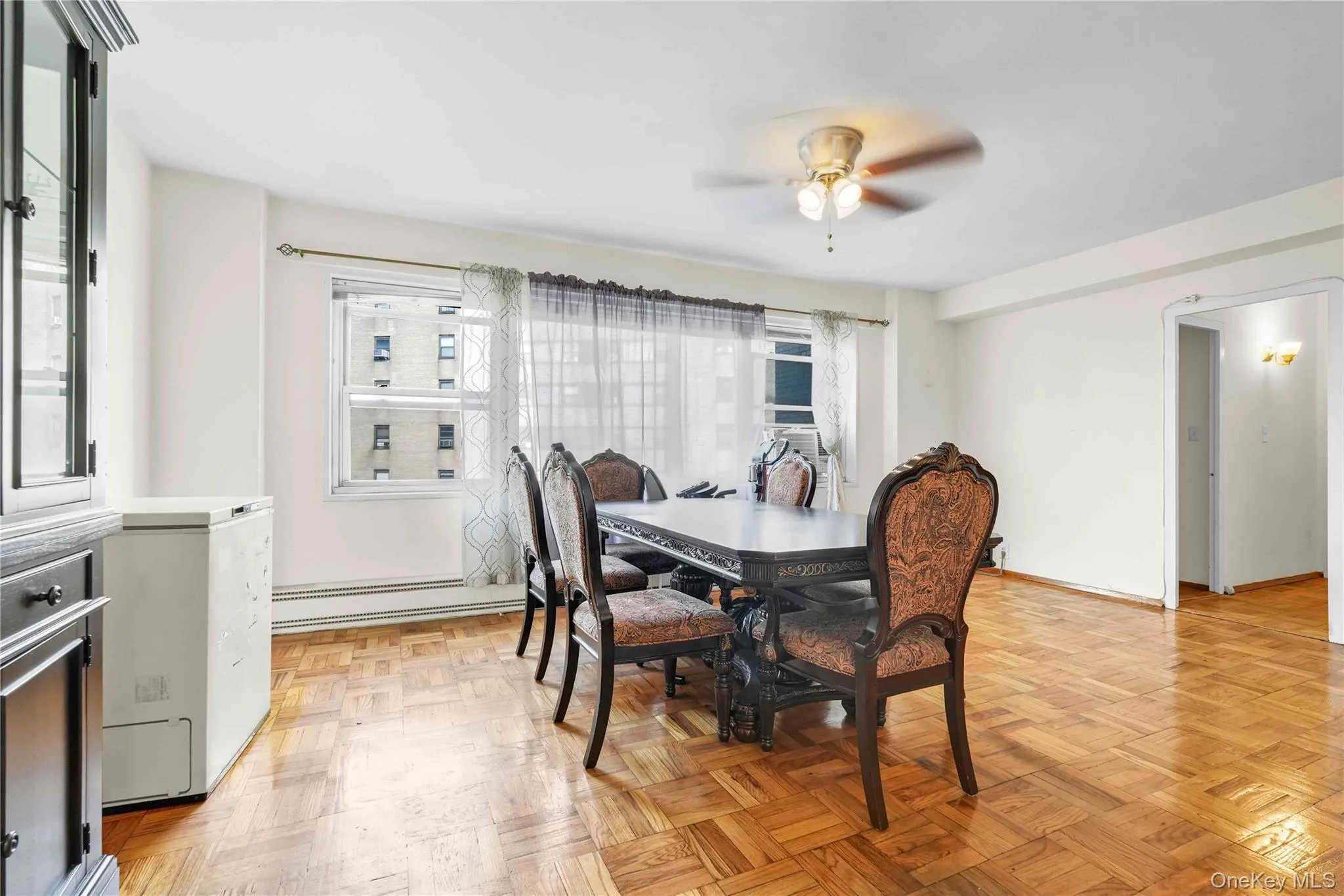 Dining area with baseboard heating and ceiling fan Dining area with baseboard heating and ceiling fan