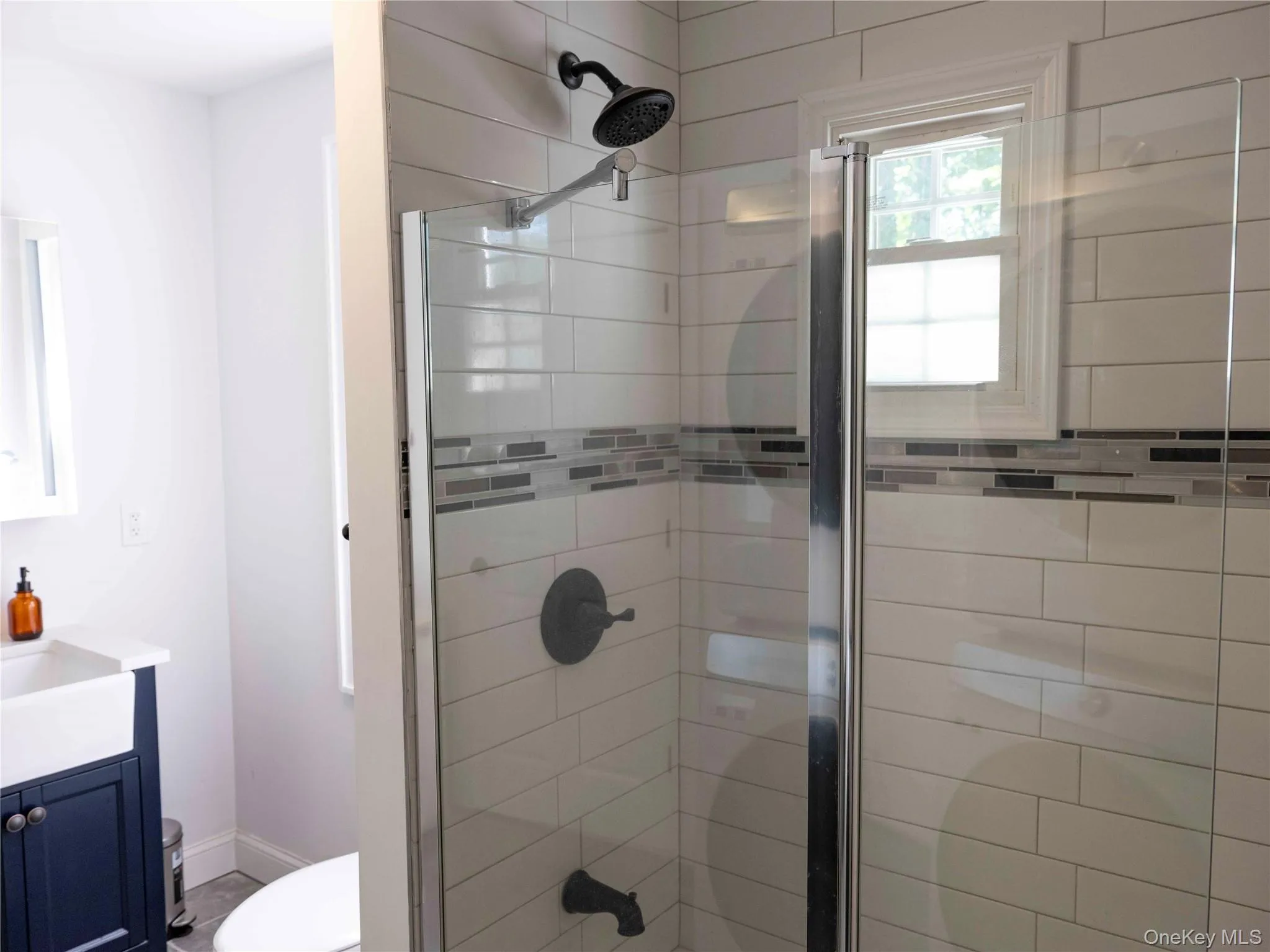 Full bathroom featuring vanity and a shower stall Full bathroom featuring vanity and a shower stall