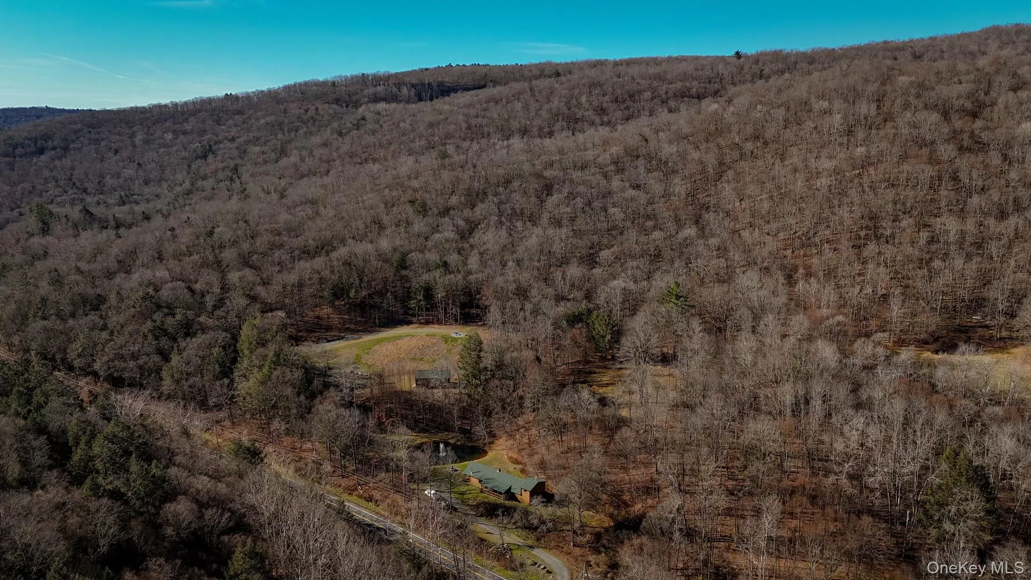 Aerial view of property's location with a heavily wooded area Aerial view of property's location with a heavily wooded area