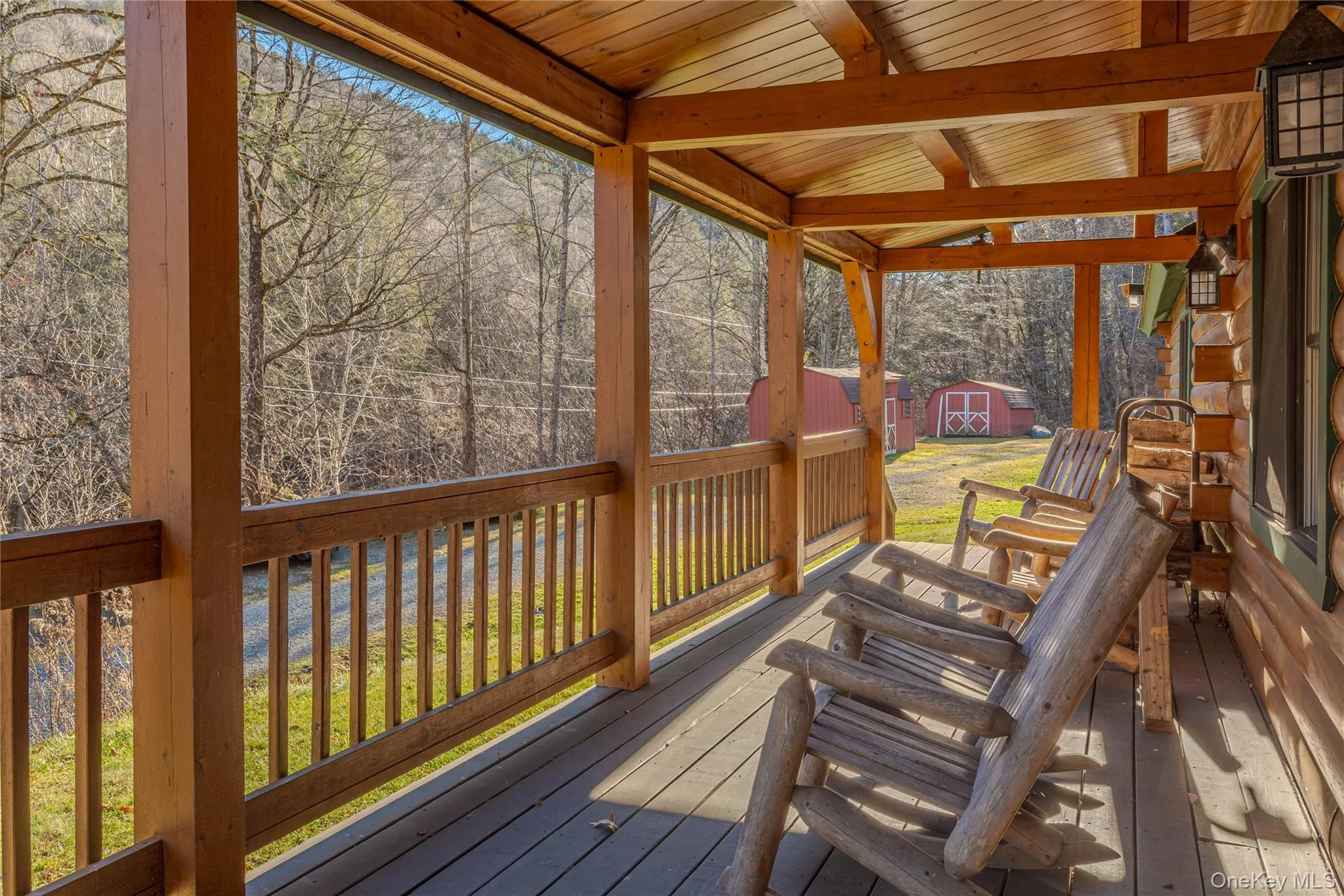 Wooden terrace featuring a storage unit Wooden terrace featuring a storage unit