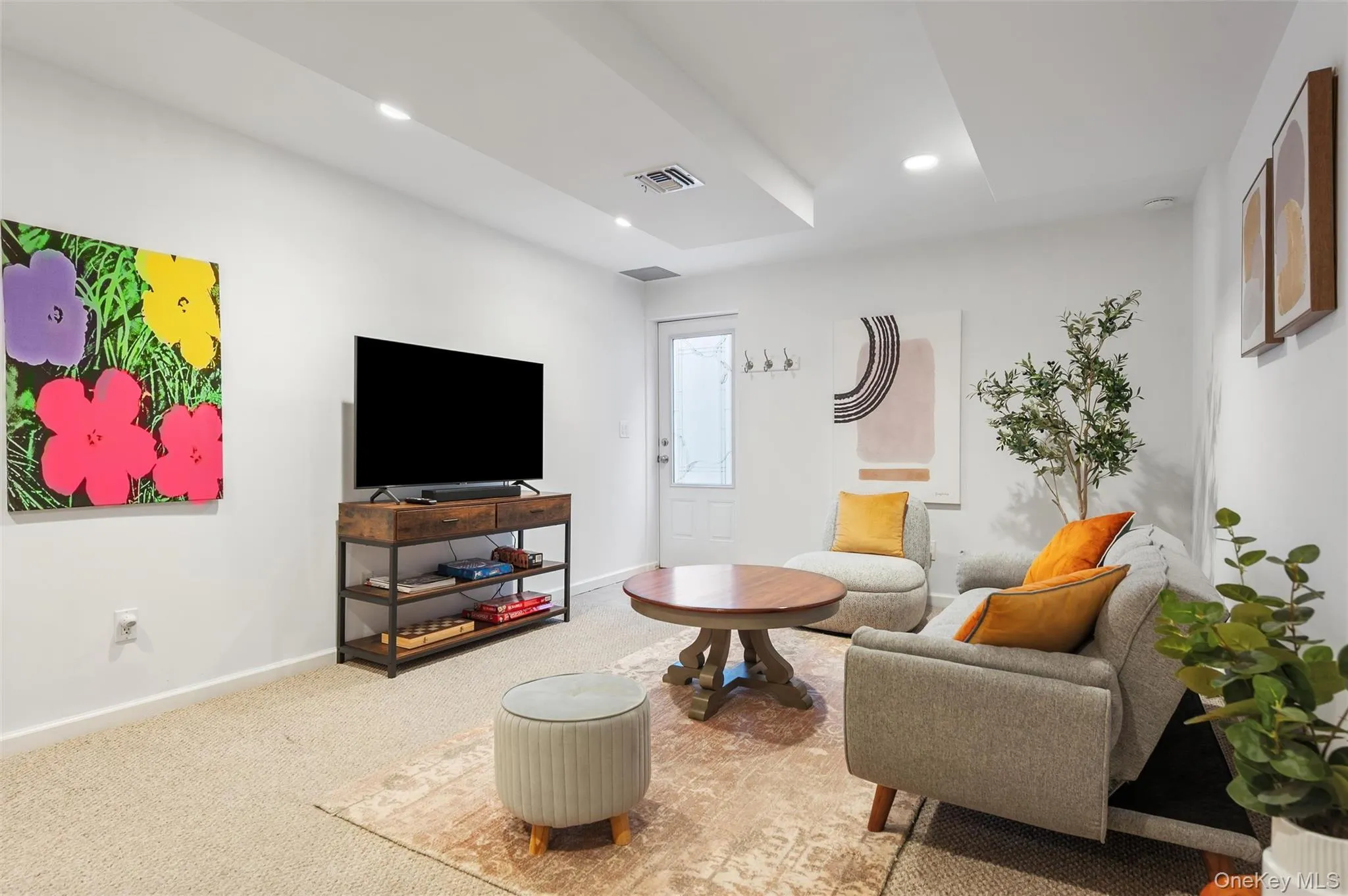 Living room featuring recessed lighting, baseboards, visible vents, and carpet floors Living room featuring recessed lighting, baseboards, visible vents, and carpet floors