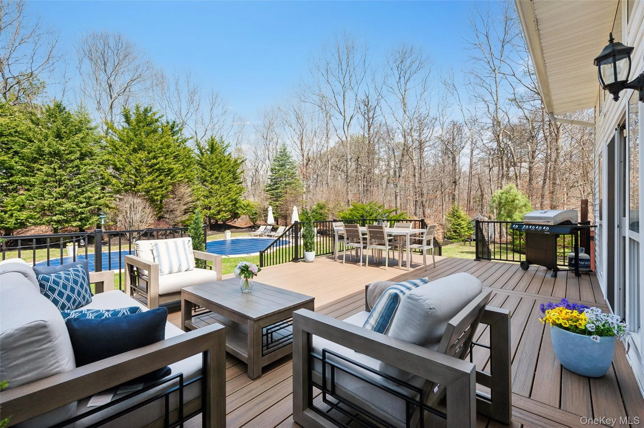 New Expansive Deck with outdoor lounge area, grilling area, a heated gunite pool, and outdoor dining space New Expansive Deck with outdoor lounge area, grilling area, a heated gunite pool, and outdoor dining space