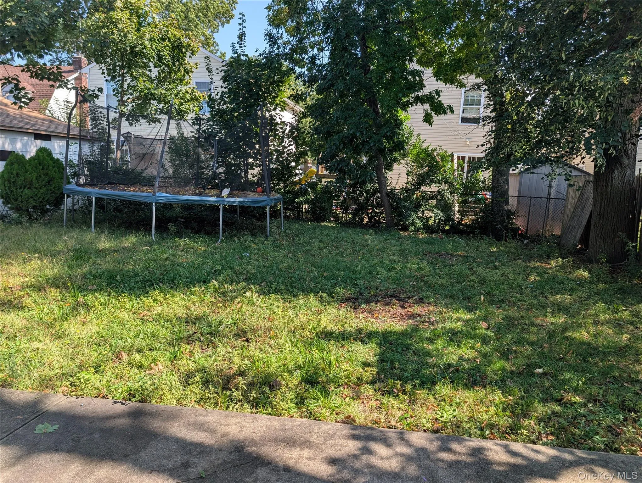 View of yard with a trampoline View of yard with a trampoline