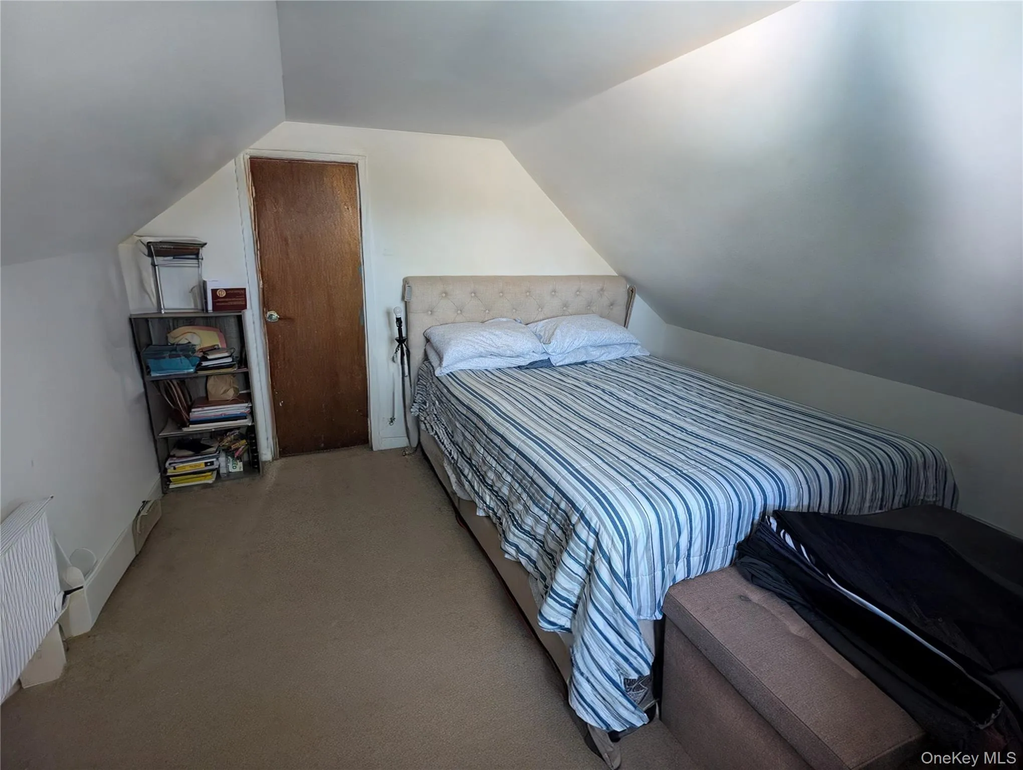 Carpeted bedroom featuring lofted ceiling Carpeted bedroom featuring lofted ceiling