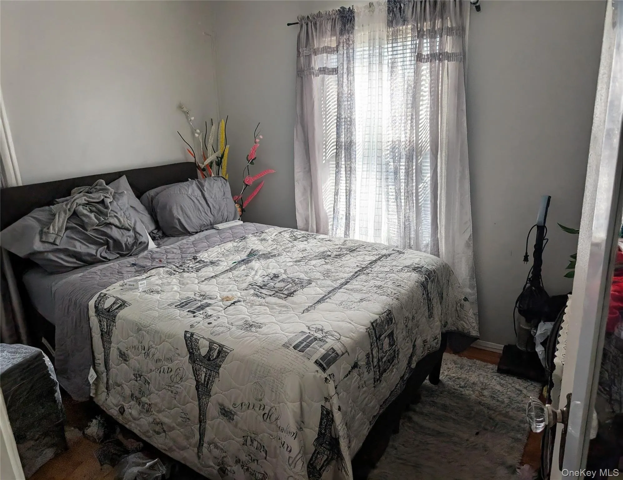 Bedroom featuring wood finished floors Bedroom featuring wood finished floors
