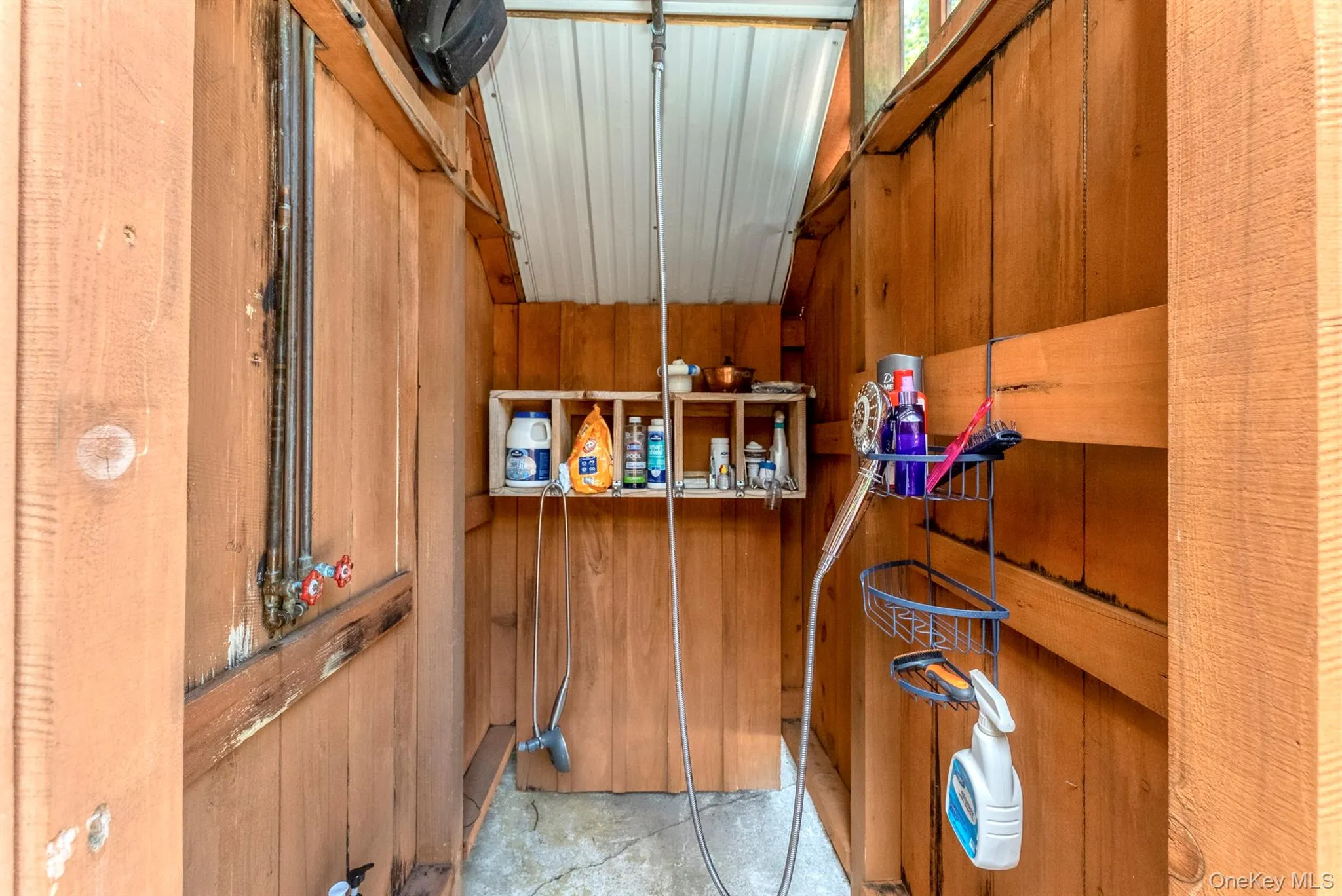 Bathroom with wood walls and light tile patterned floors Bathroom with wood walls and light tile patterned floors