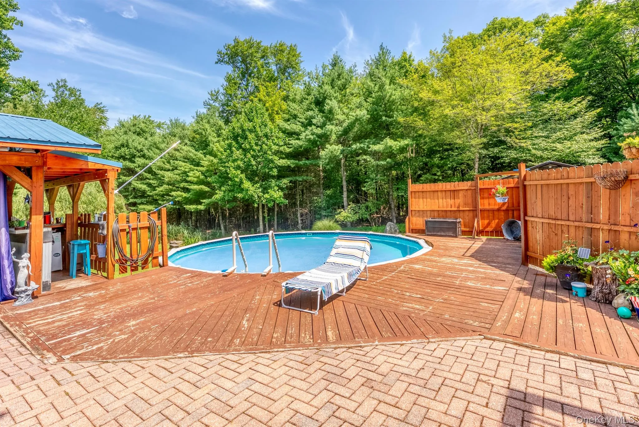 View of pool with a deck View of pool with a deck