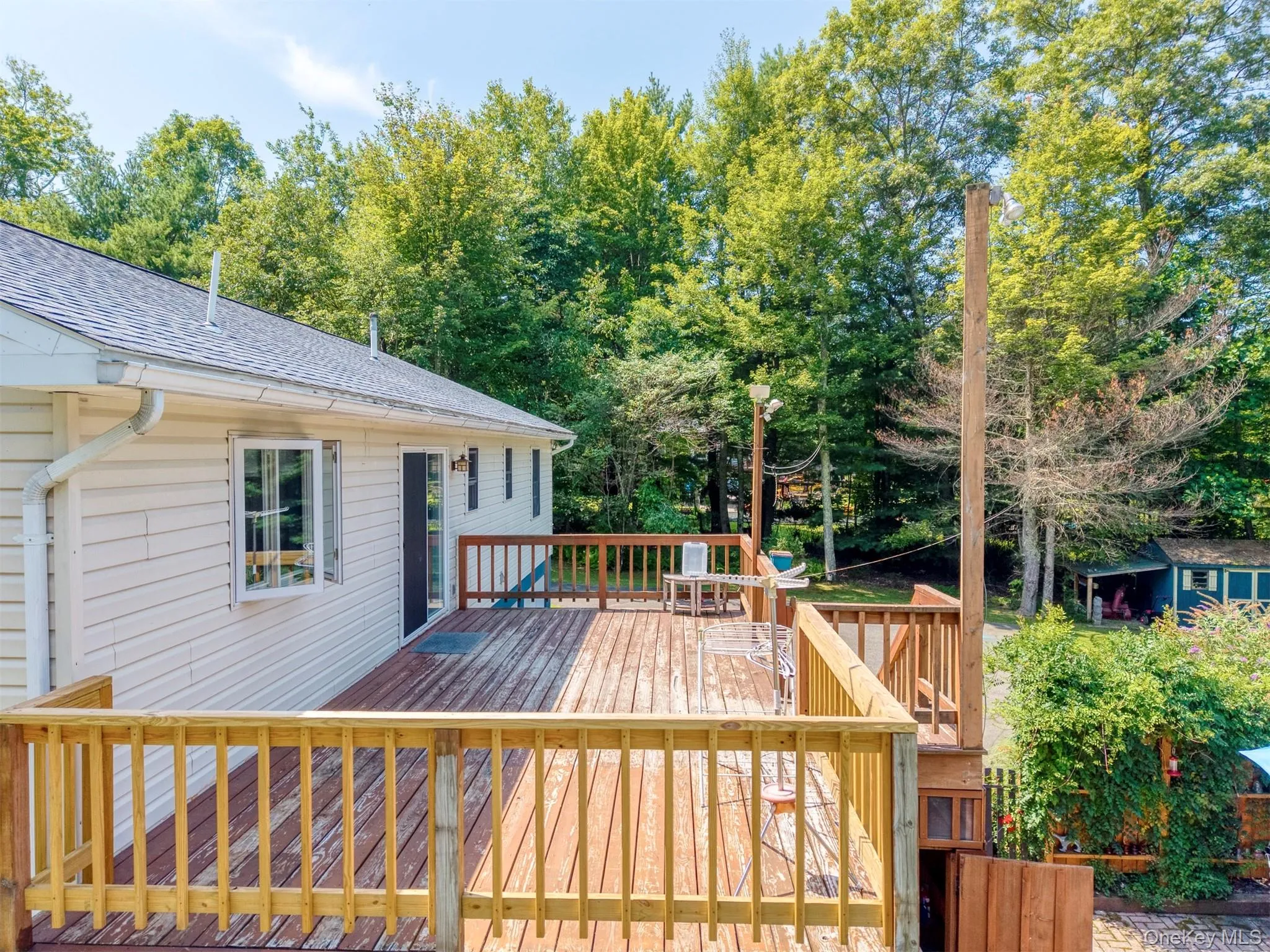 Deck featuring view of wooded area Deck featuring view of wooded area