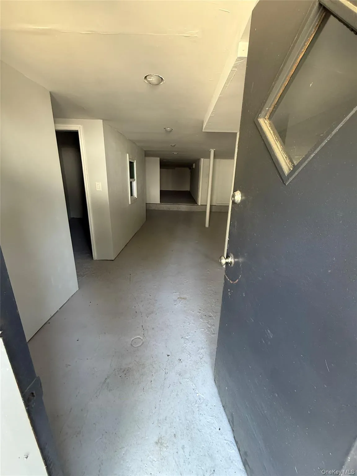 Corridor featuring concrete floors Corridor featuring concrete floors