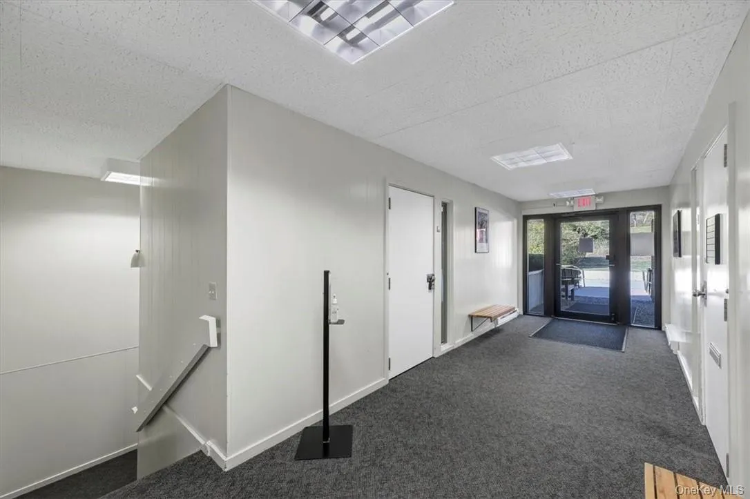 Common Area and office door to suite 201. Stairs to Lower Level. Door out to Upper Parking Lot. Common Area and office door to suite 201. Stairs to Lower Level. Door out to Upper Parking Lot.