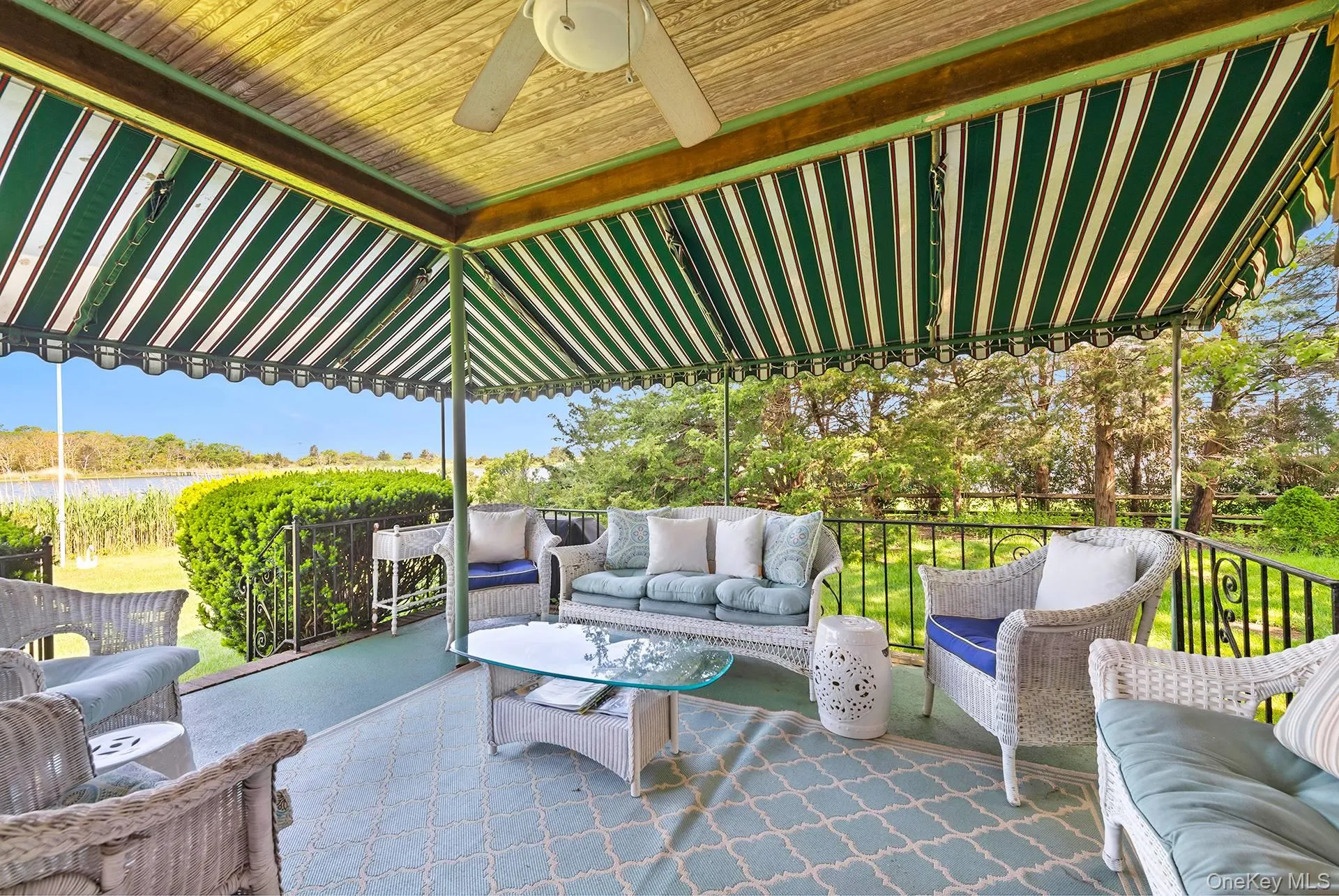 View of patio / terrace featuring outdoor lounge area, a ceiling fan, and a water view View of patio / terrace featuring outdoor lounge area, a ceiling fan, and a water view
