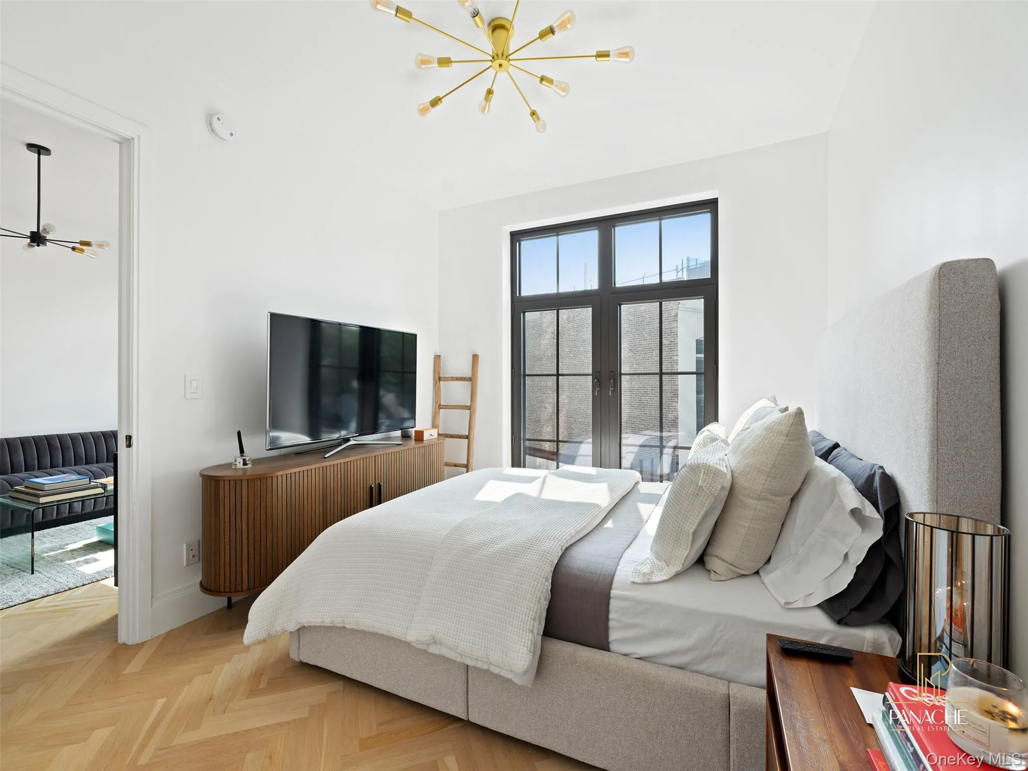 Bedroom featuring a chandelier and baseboards Bedroom featuring a chandelier and baseboards