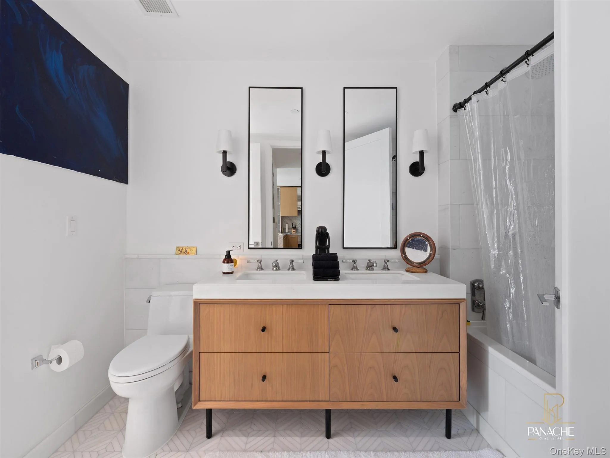 Full bath with shower / bathtub combination with curtain and a sink Full bath with shower / bathtub combination with curtain and a sink
