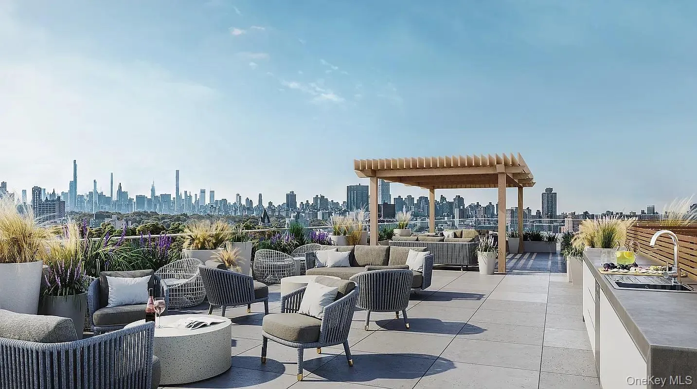View of patio / terrace featuring outdoor lounge area and a view of skyline View of patio / terrace featuring outdoor lounge area and a view of skyline