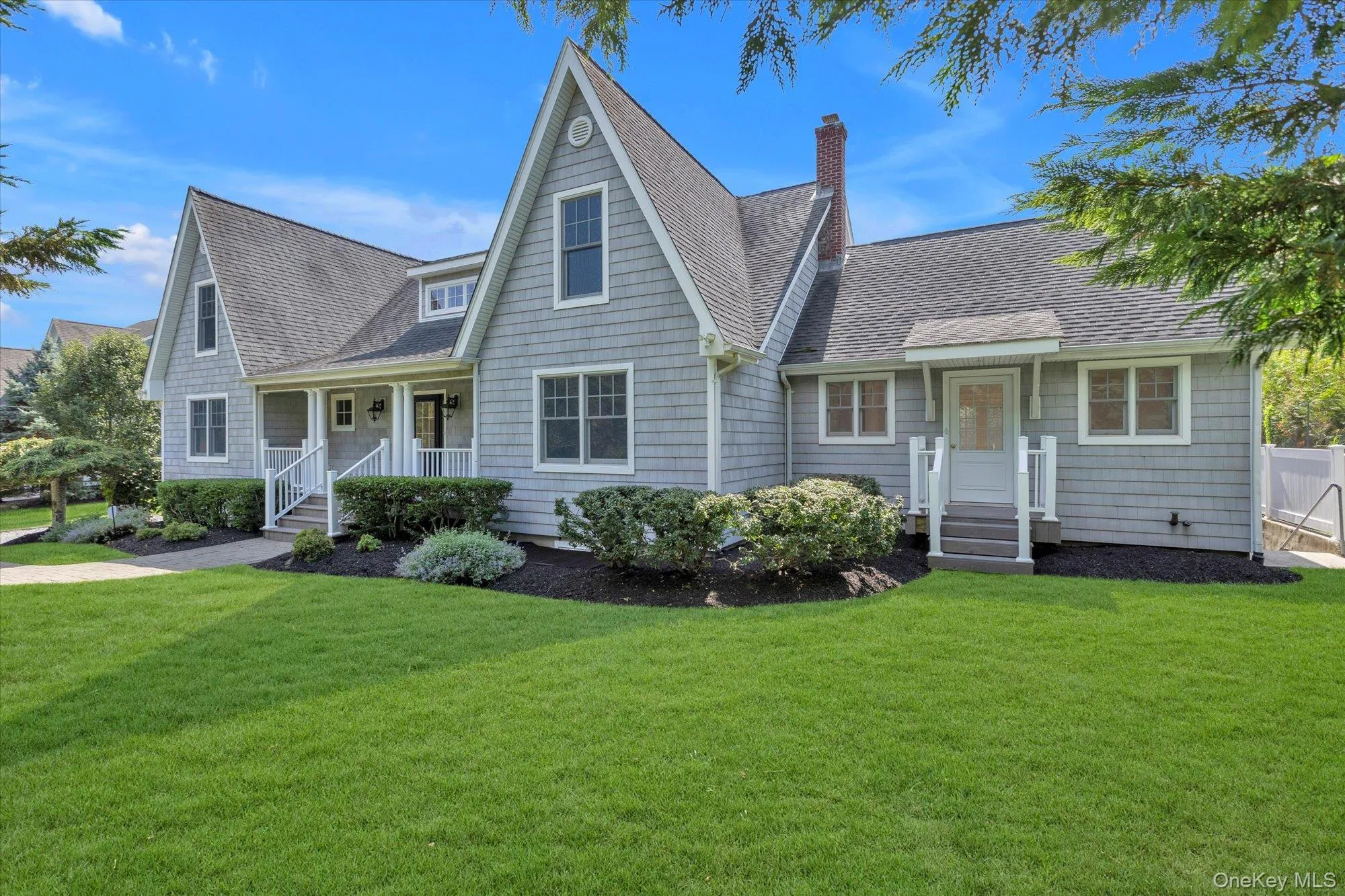 View of front of house featuring roof with shingles, a front yard, and a chimney View of front of house featuring roof with shingles, a front yard, and a chimney
