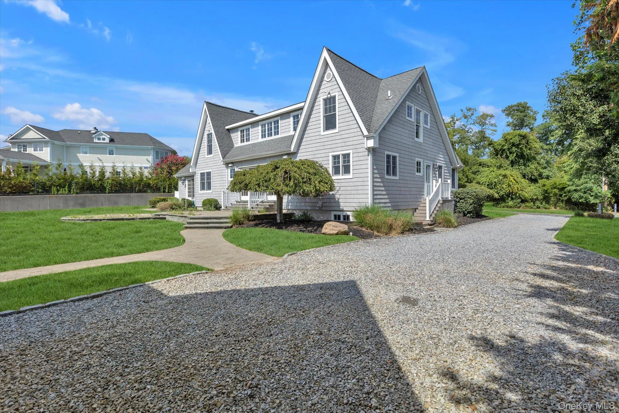 View of front of property with a front yard and roof with shingles View of front of property with a front yard and roof with shingles