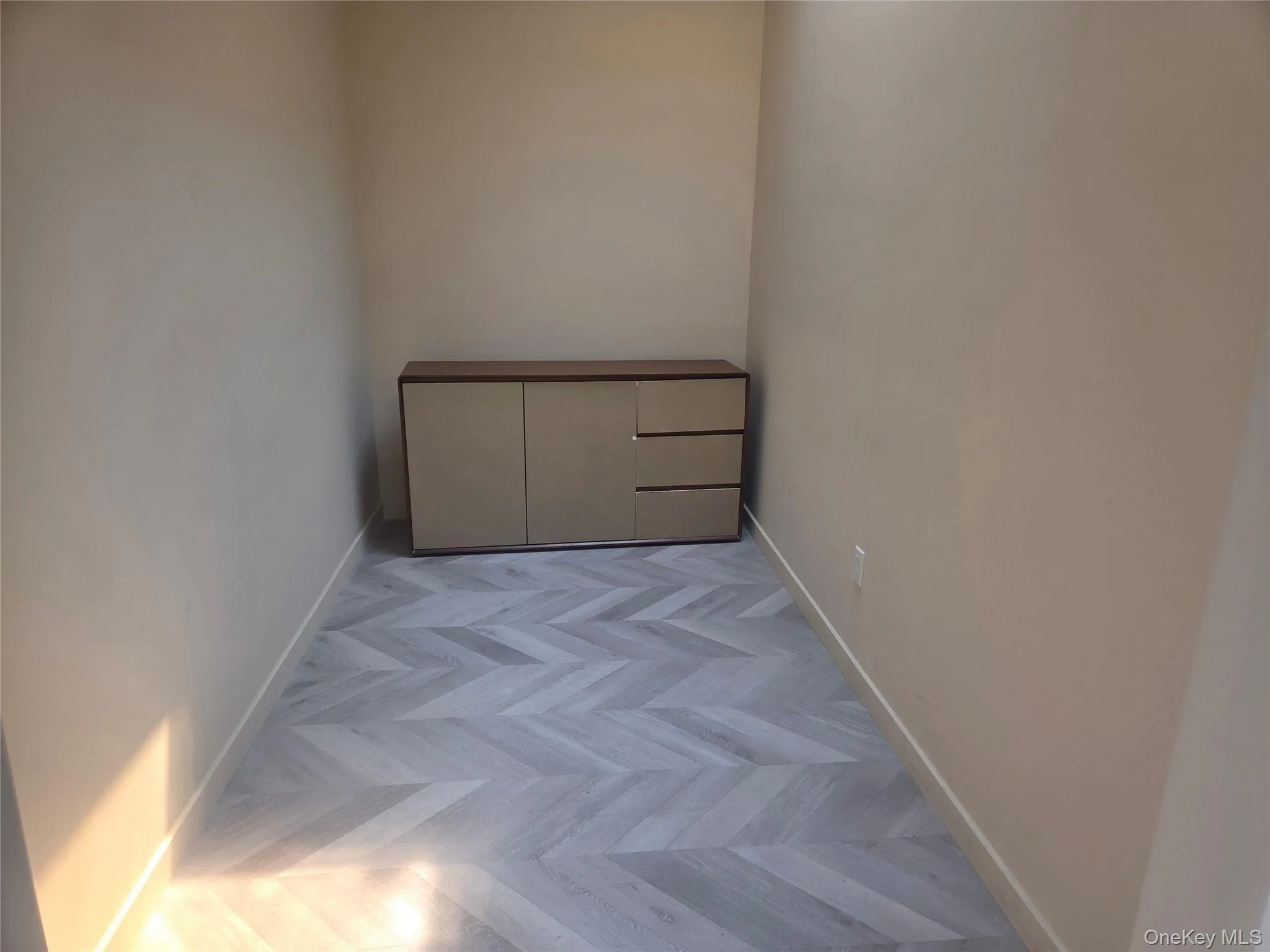 Unfurnished room with baseboards Unfurnished room with baseboards