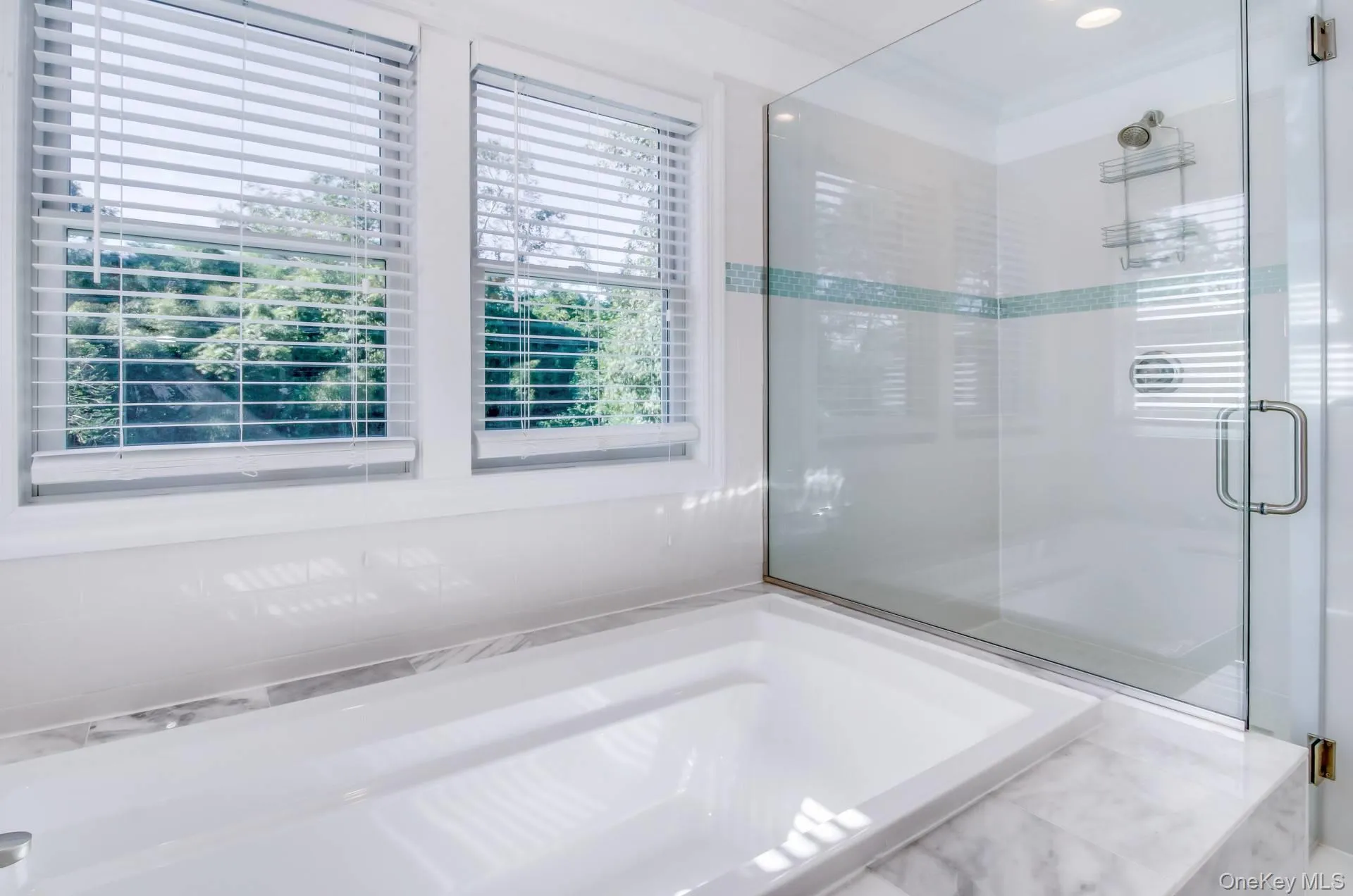 Full bath with a stall shower and a garden tub Full bath with a stall shower and a garden tub